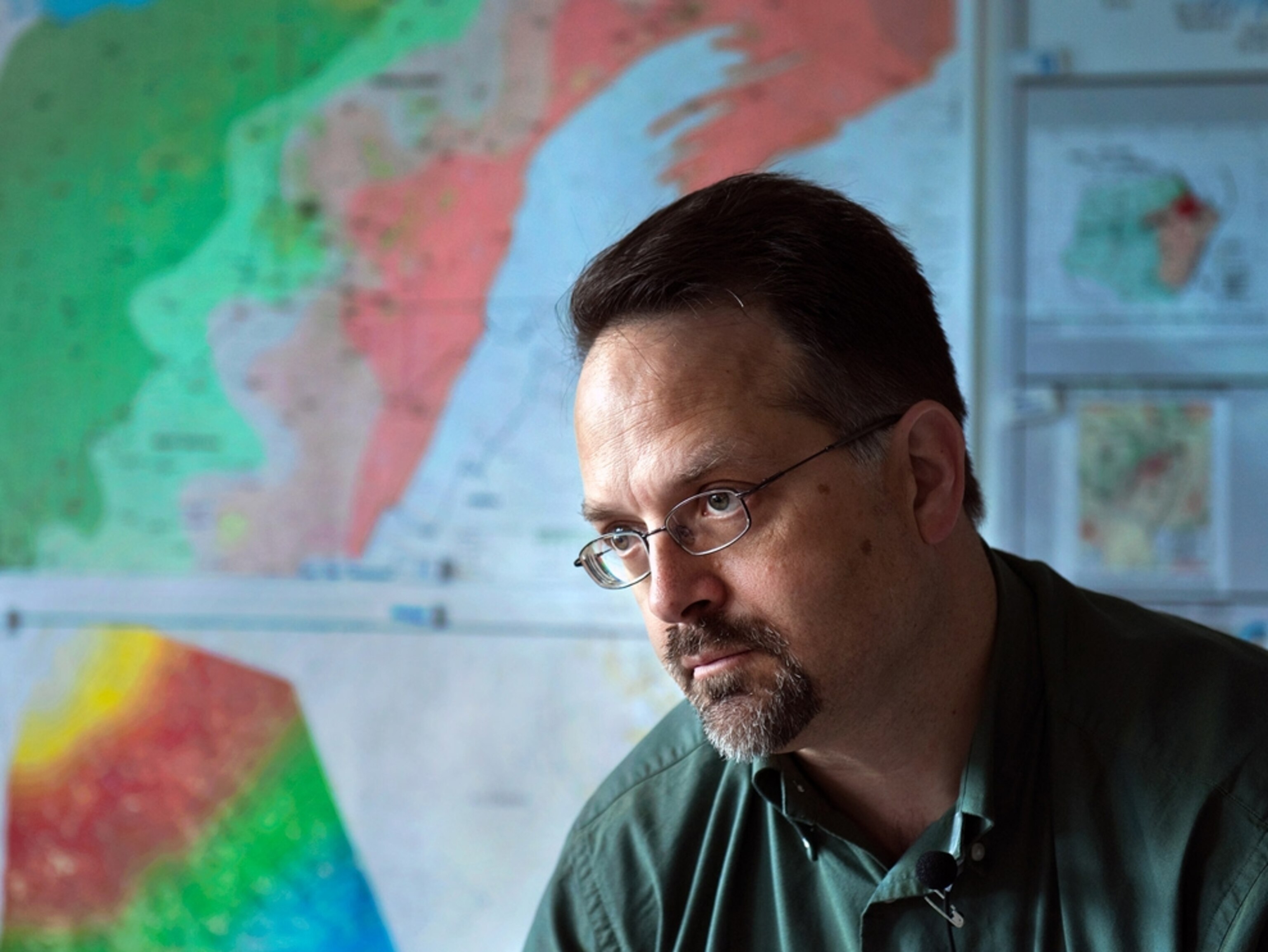 William Zagorski, Range Resources vice president of Geology, in front of geological maps.