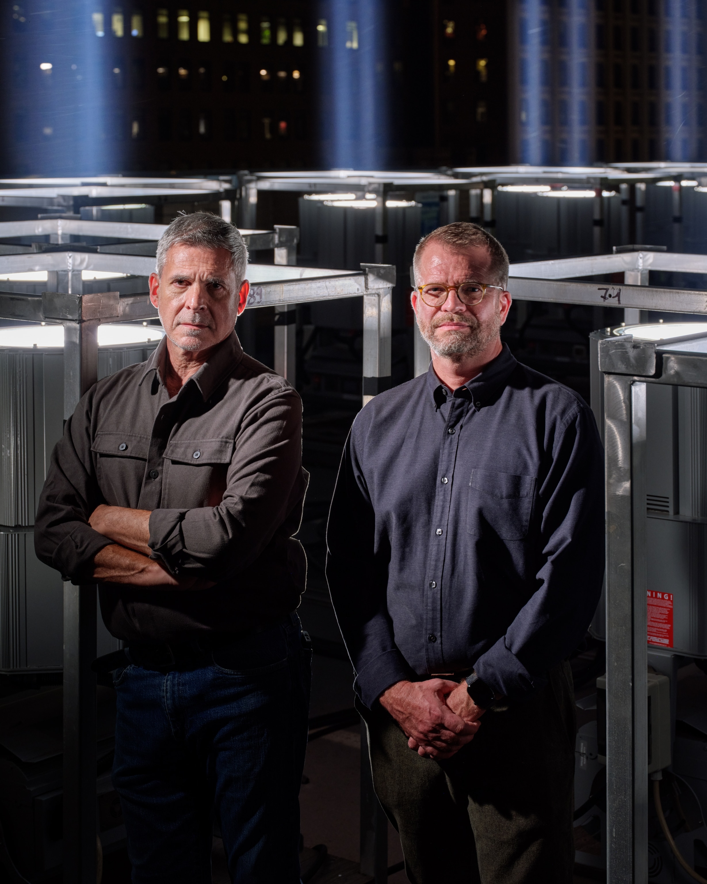 two gentleman standing near light structure