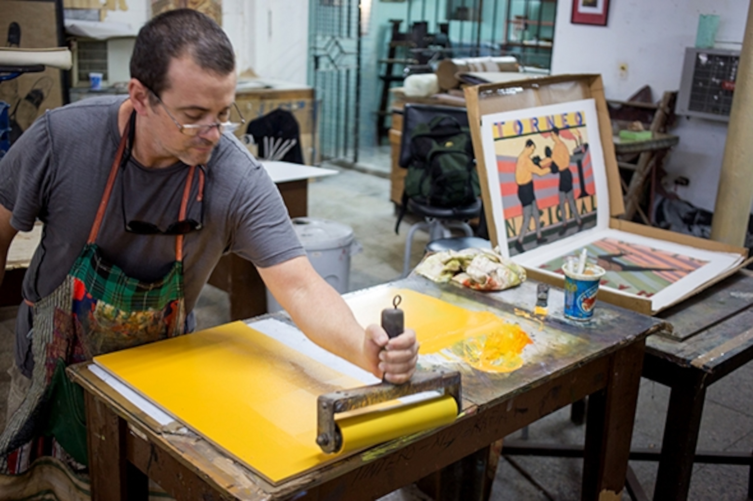 An artist at work in Havana's Taller Experimental de Grafica workshop. (Photograph by Erika Skogg)