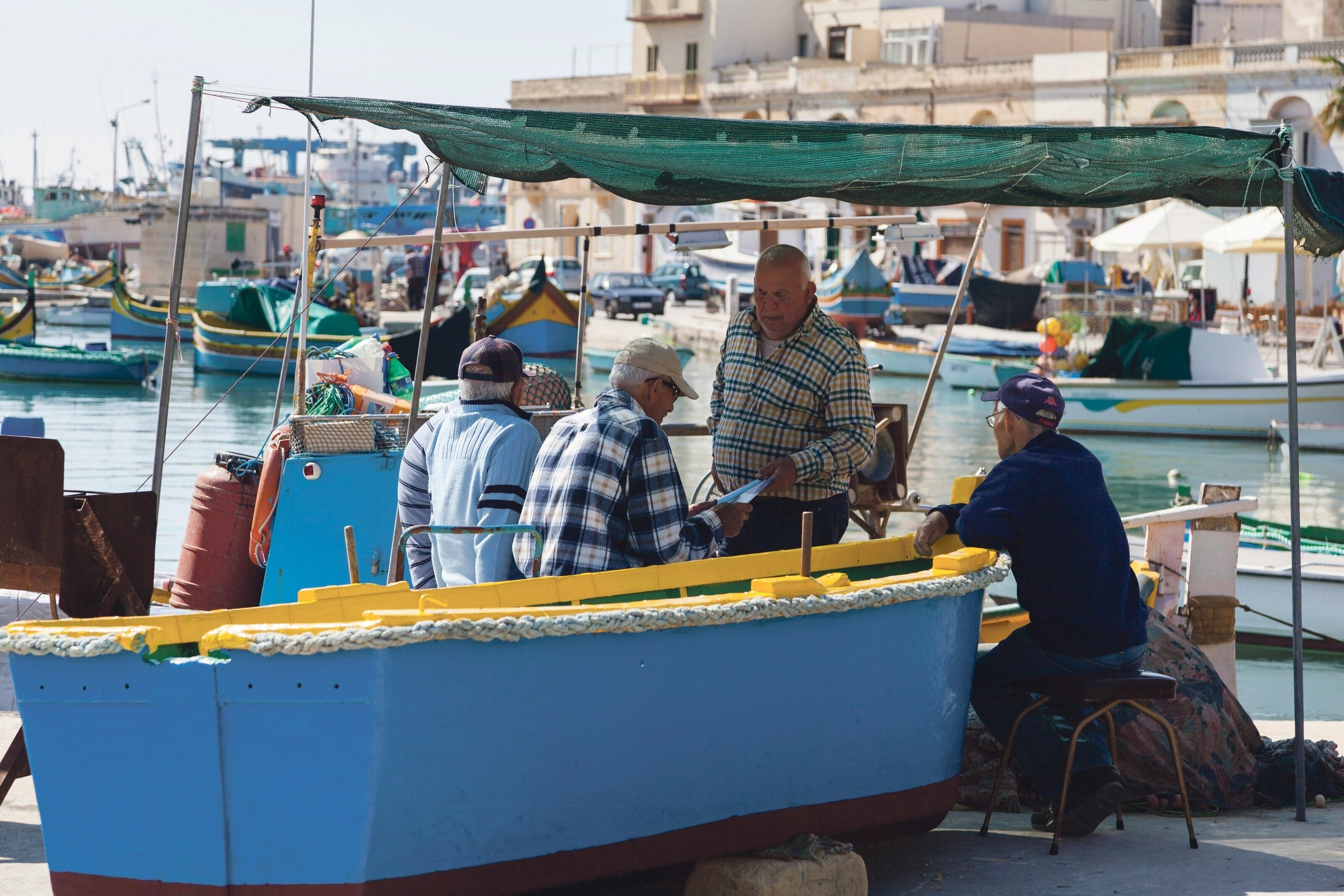 Traditional fishing boats line up in the fishing village, Marsaxlokk.