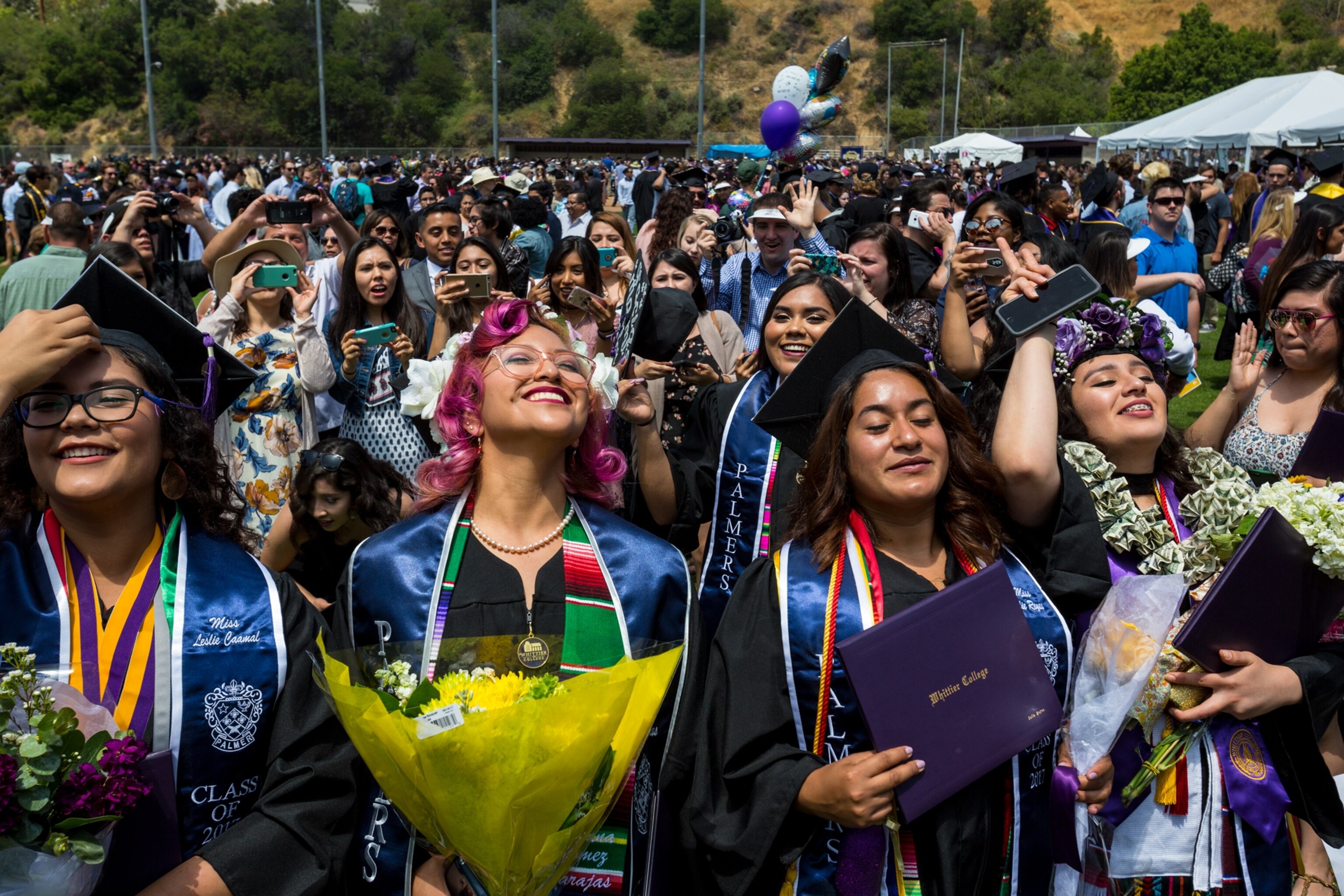 young women celebrating their graduation from Whittier College in California.