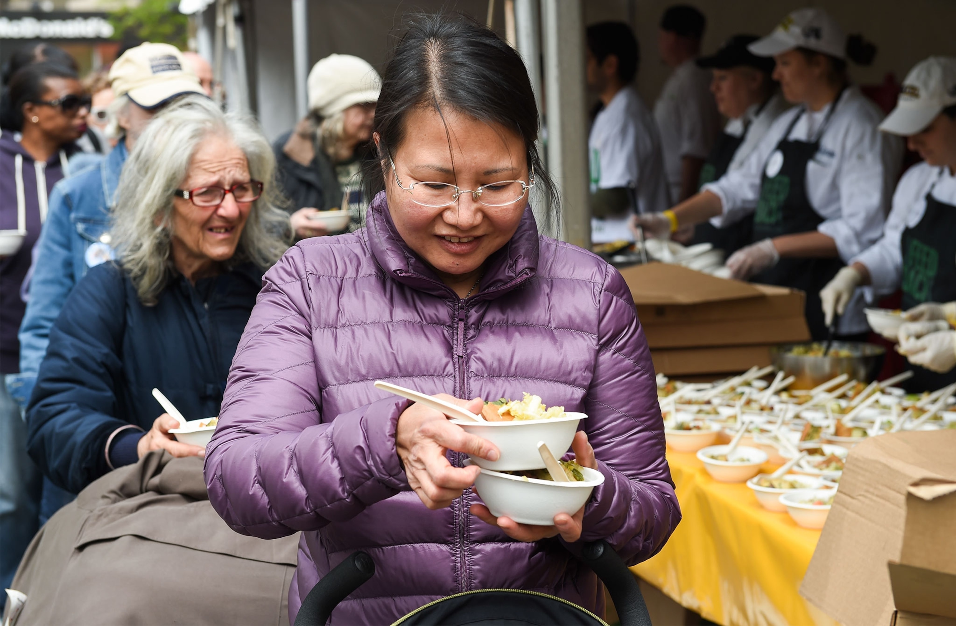 a woman with food from the Feeding the 5000 event in New York City