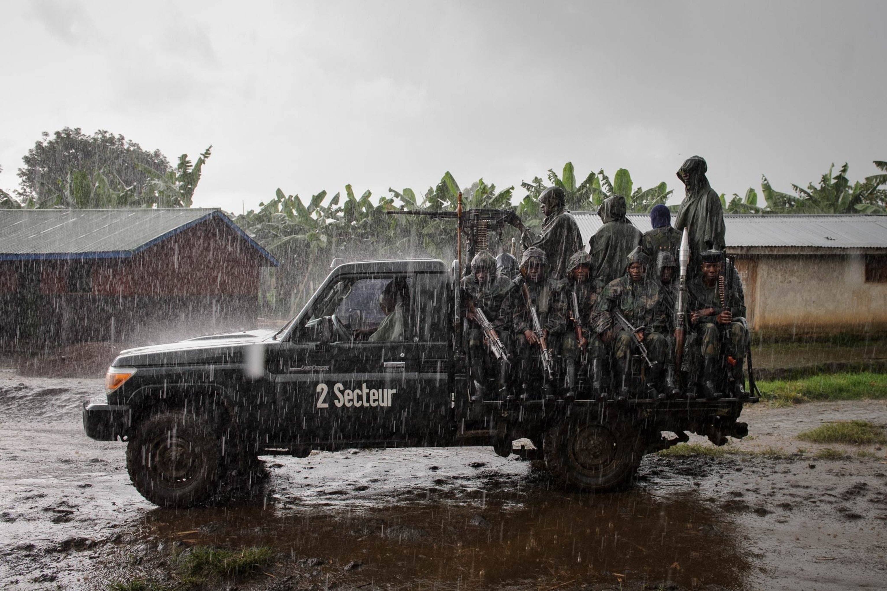 Congolese commandos celebrate as they advance up the mountainous road toward Bunagana, the last remaining stronghold of the M-23 rebels on Wednesday.(Pete Muller for the New York Times)