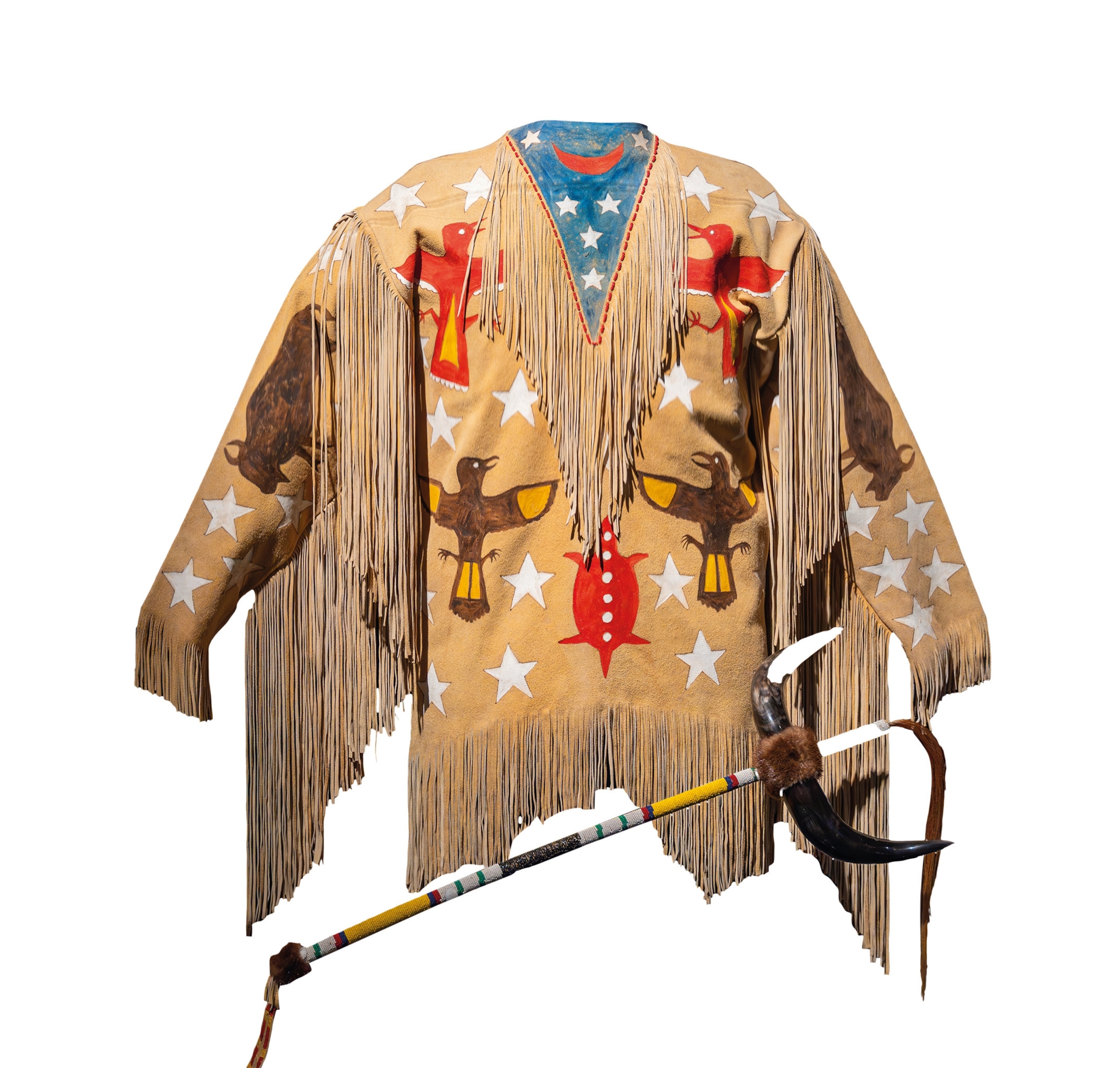 An Arapaho buckskin Ghost Dance shirt is pictured.