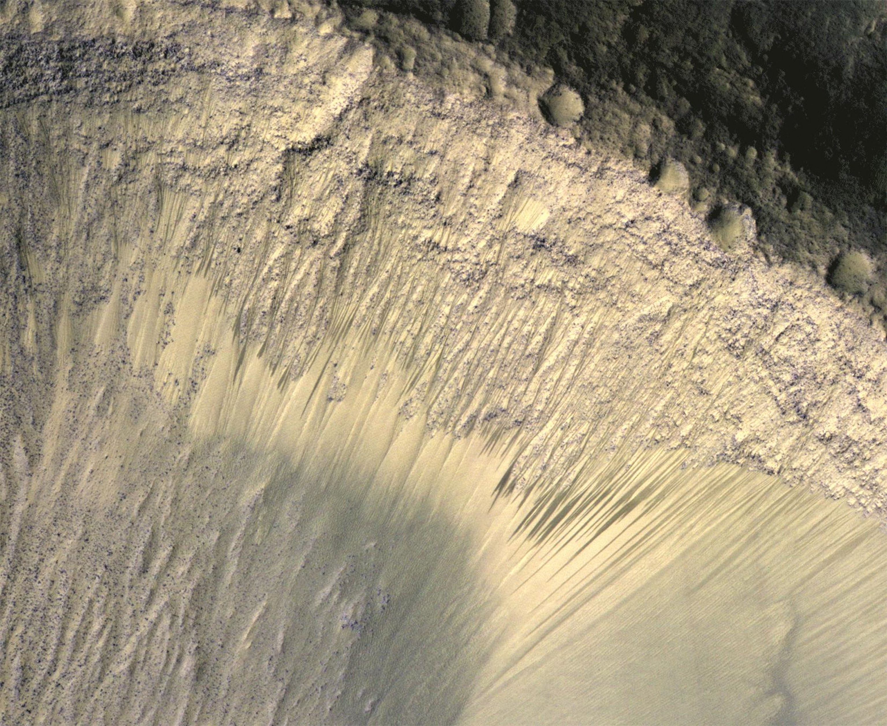 Mars showing how the appearance of dark markings on Martian slope changes with the seasons.