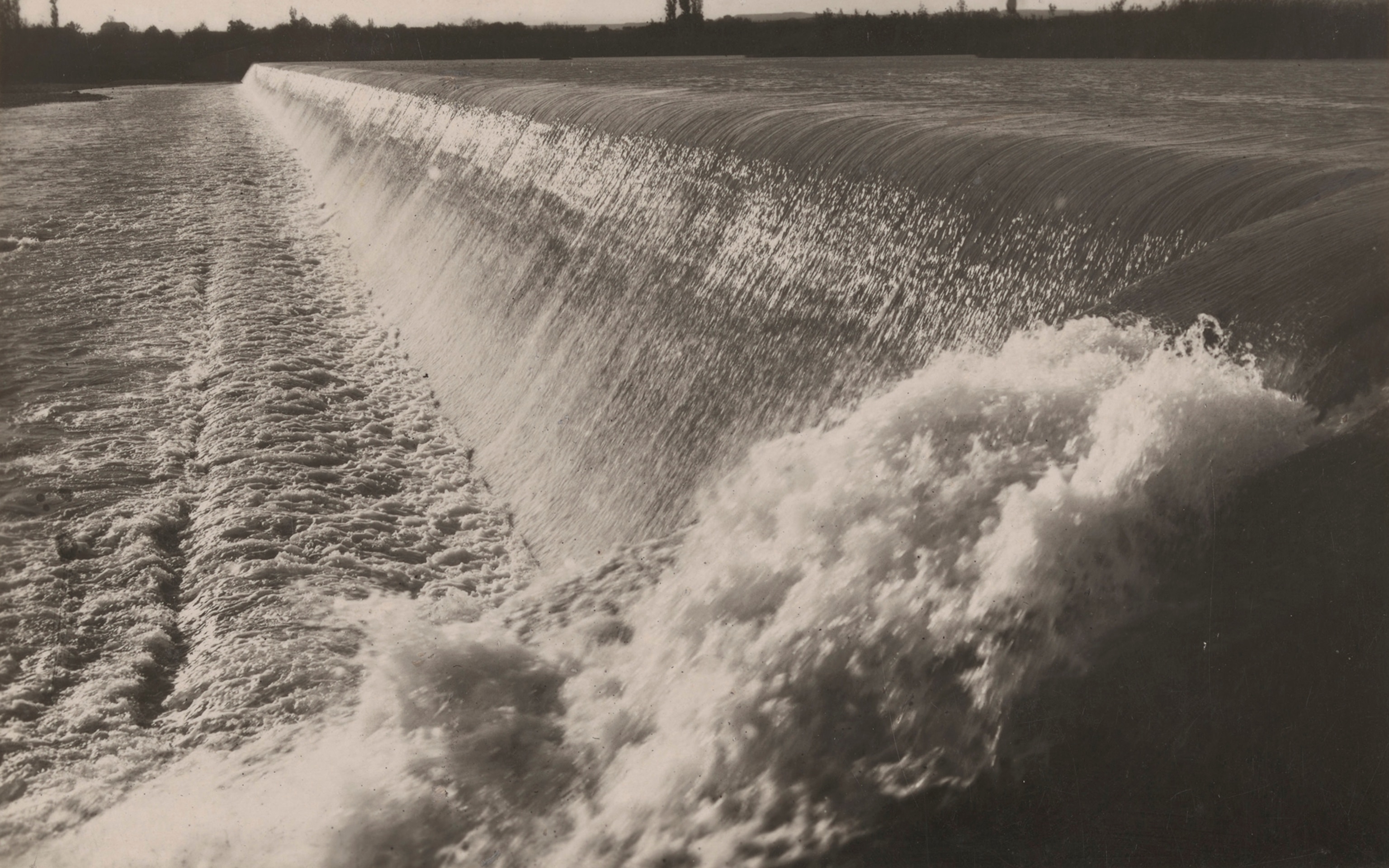 Water rushes in a waterfall in the great dam of the canal of Lerida at Seros.