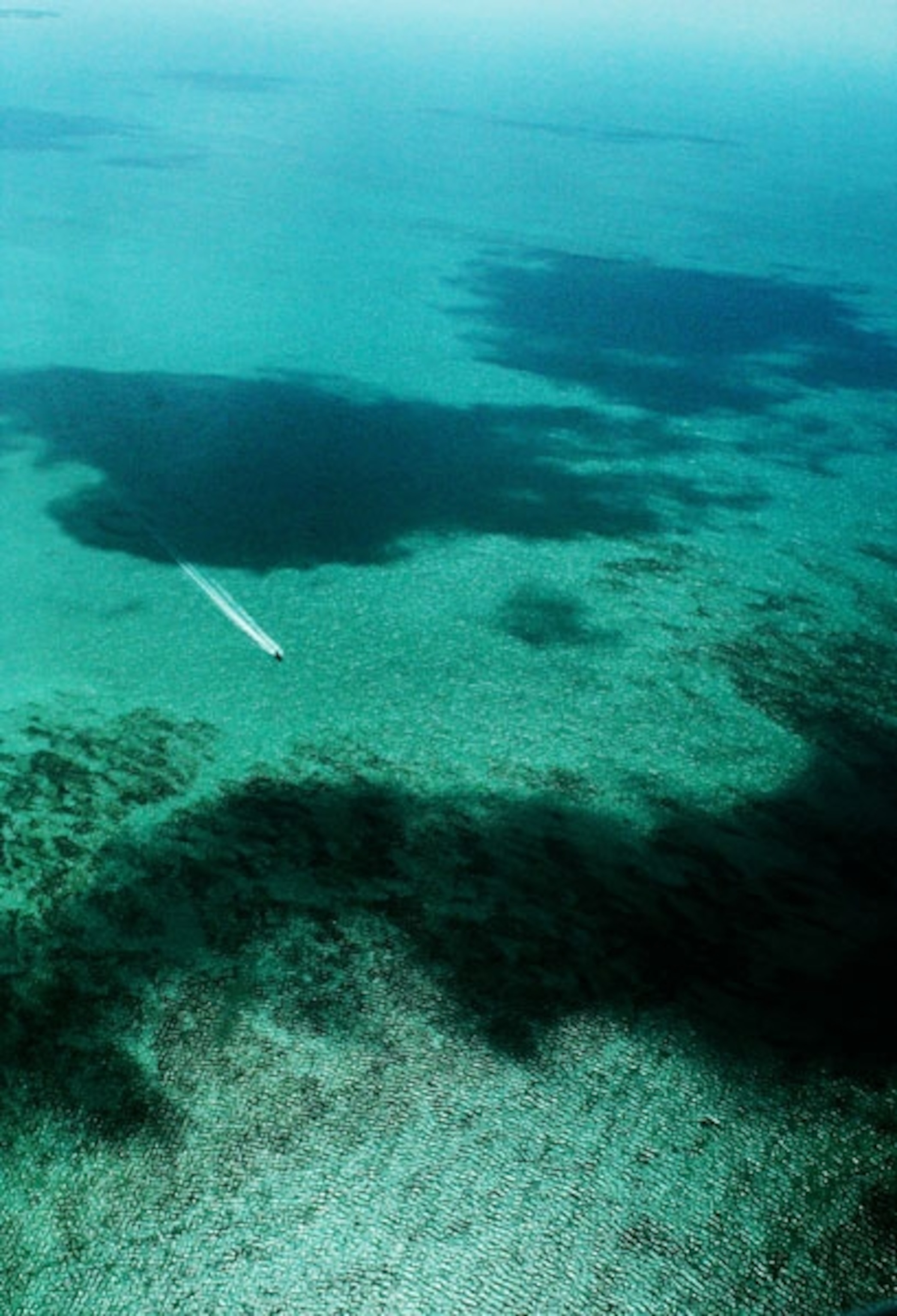 Shadows of clouds cast on shallow Caribbean waters My Shot