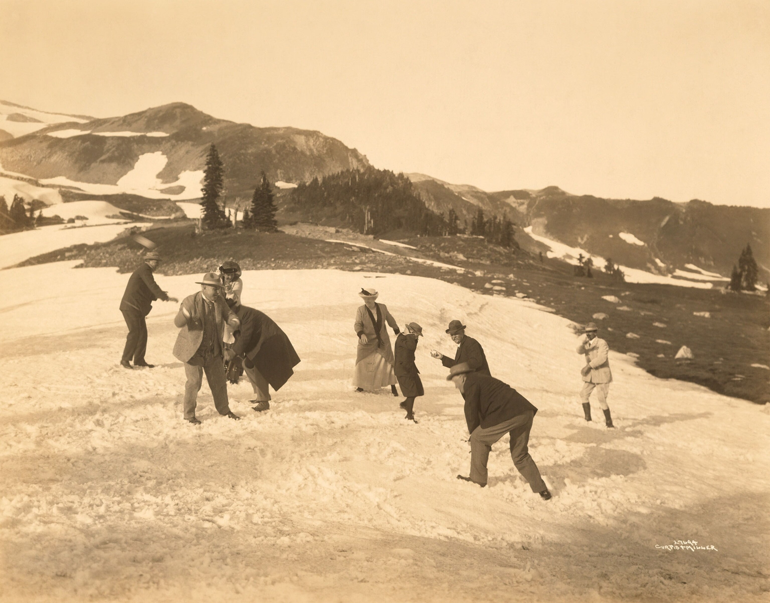 a family playing in the snow in Mount Rainier National Park