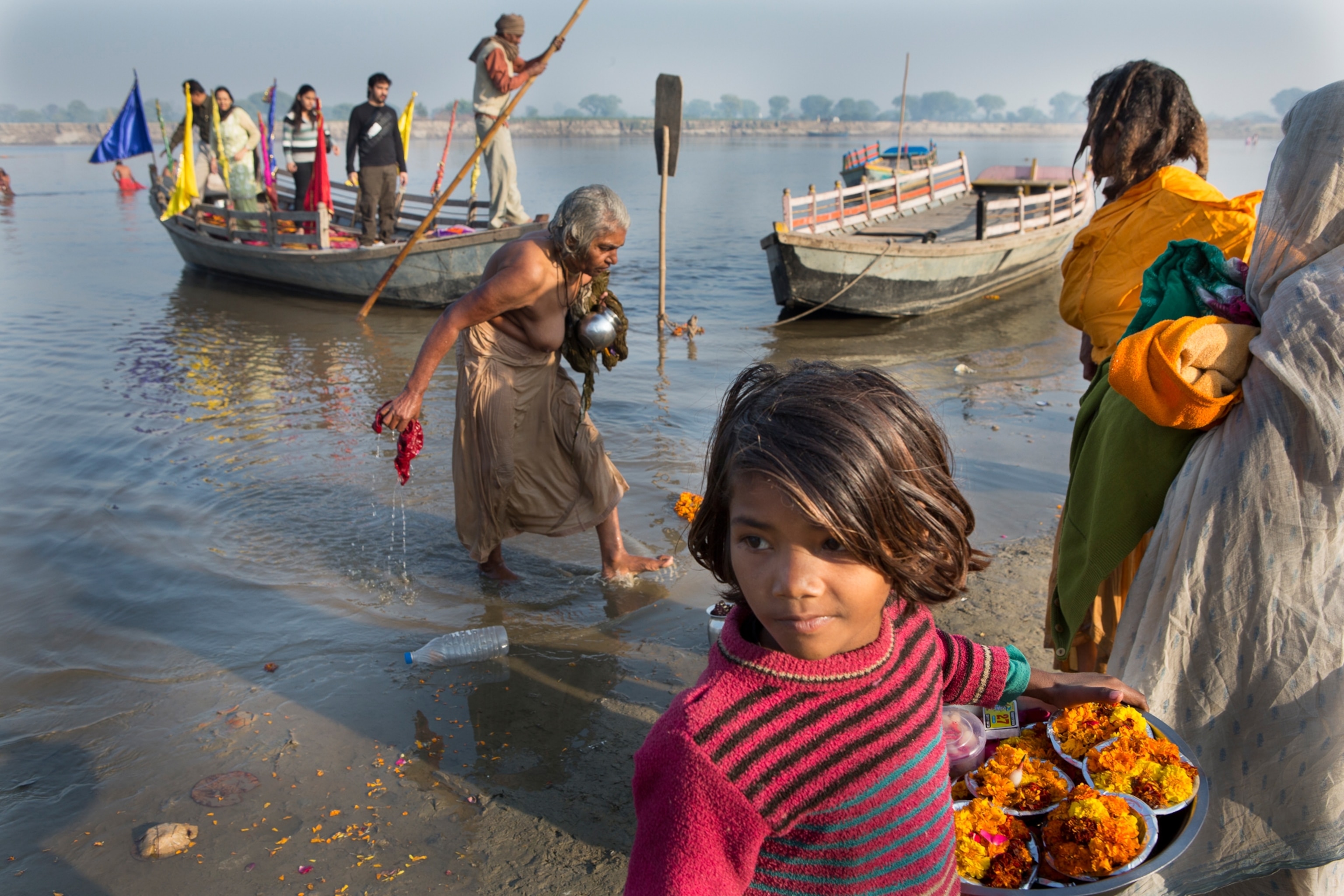 a young girl selling flowers
