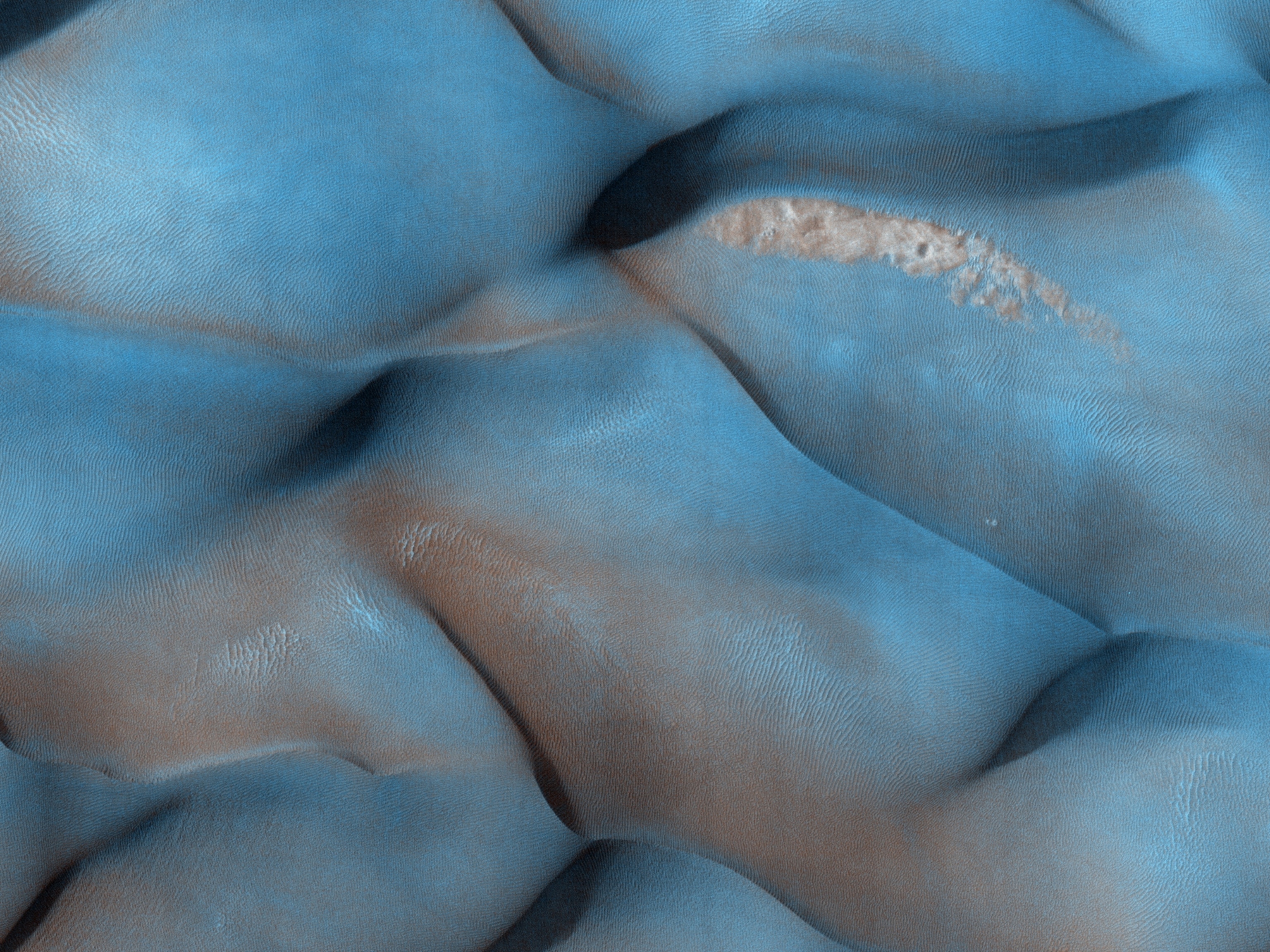 Journalists dressed in special suits are briefed inside the Clean Room at NASA's Jet Propulsion Laboratory in Pasadena, California on the agency's Low Density Supersonic Decelerator (LDSD) project on April 9, 2014. The rocket-powered, flying saucer-shaped test vehicle will soon be sent to Hawaii from where it will be propelled into near-space in June from the US Navy's Pacific Missile Range Facility on the island of Kauai, Hawaii.