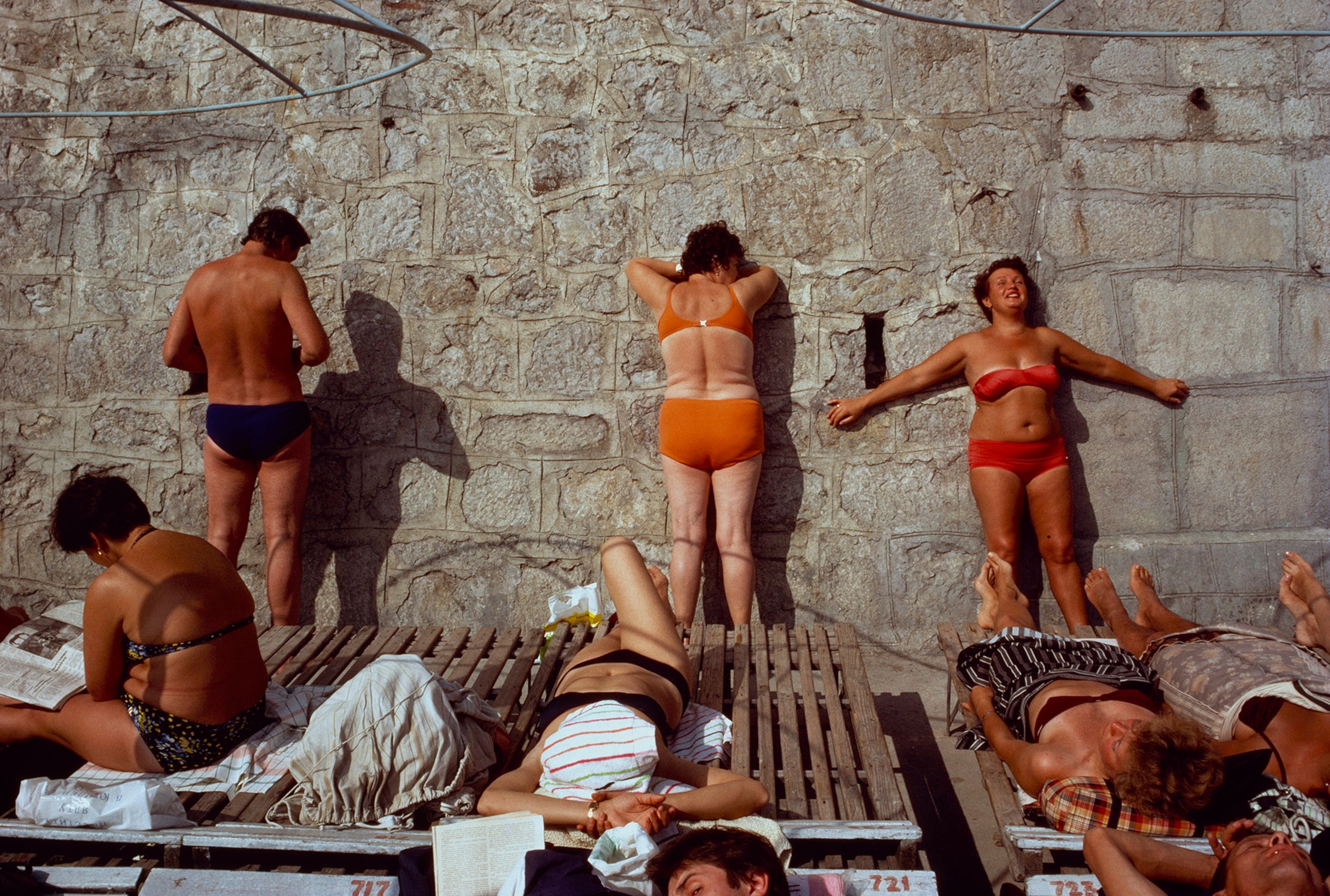 people laying out in the sun