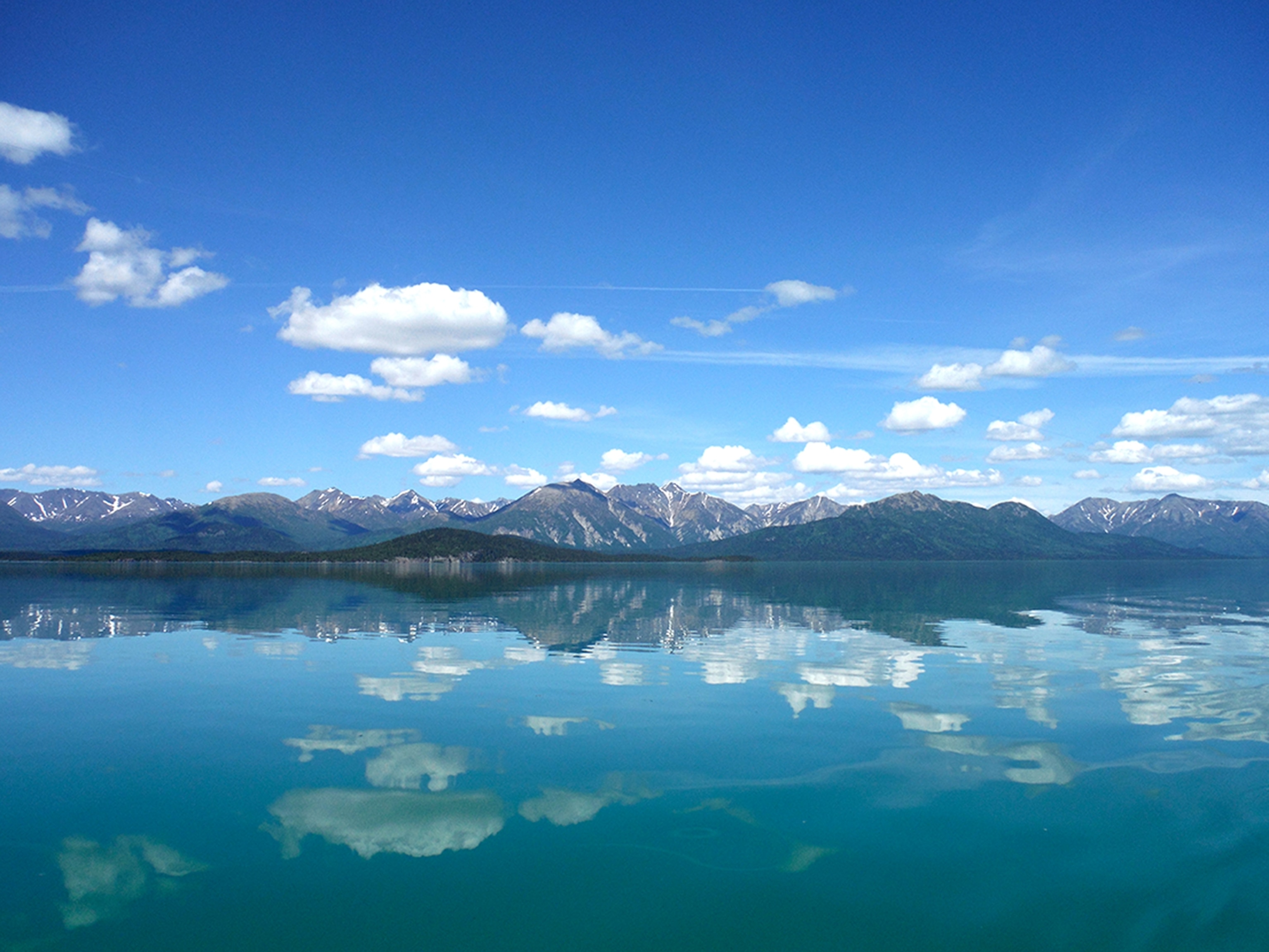 A bright blue lake reflecting the blue sky