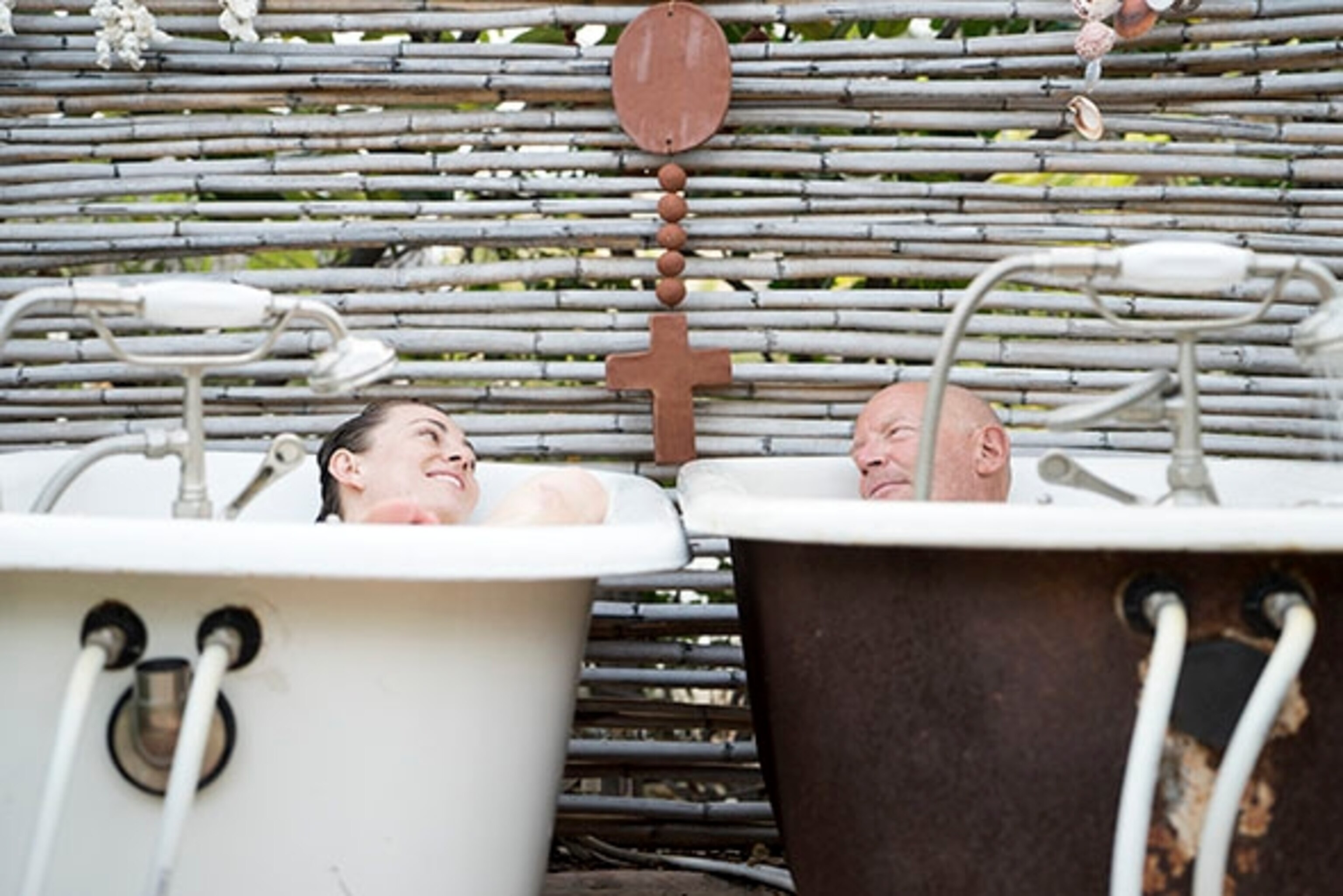 Catherine and Chris enjoy a bath together on the compound; Photograph by Max Lowe