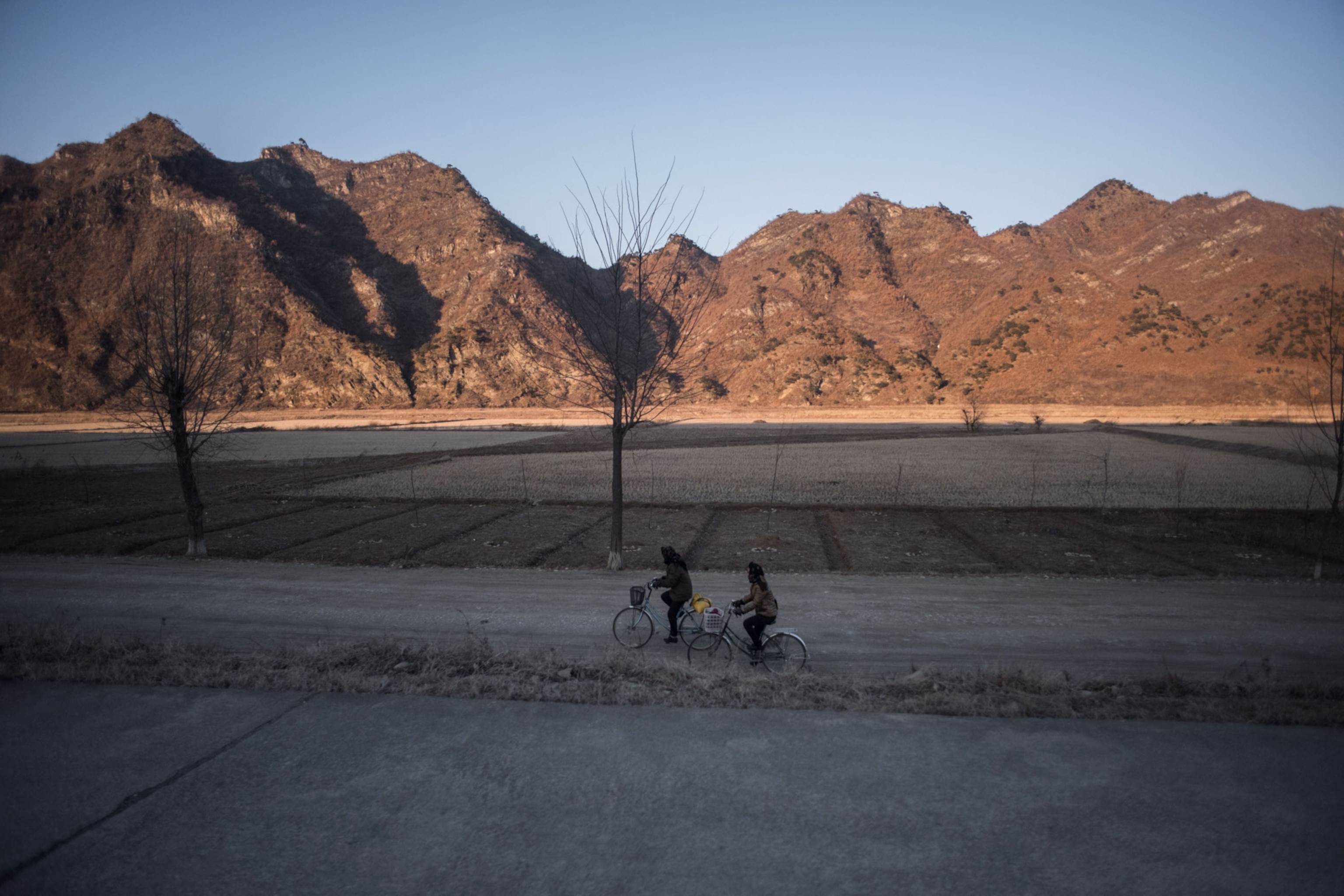 people biking in North Korea