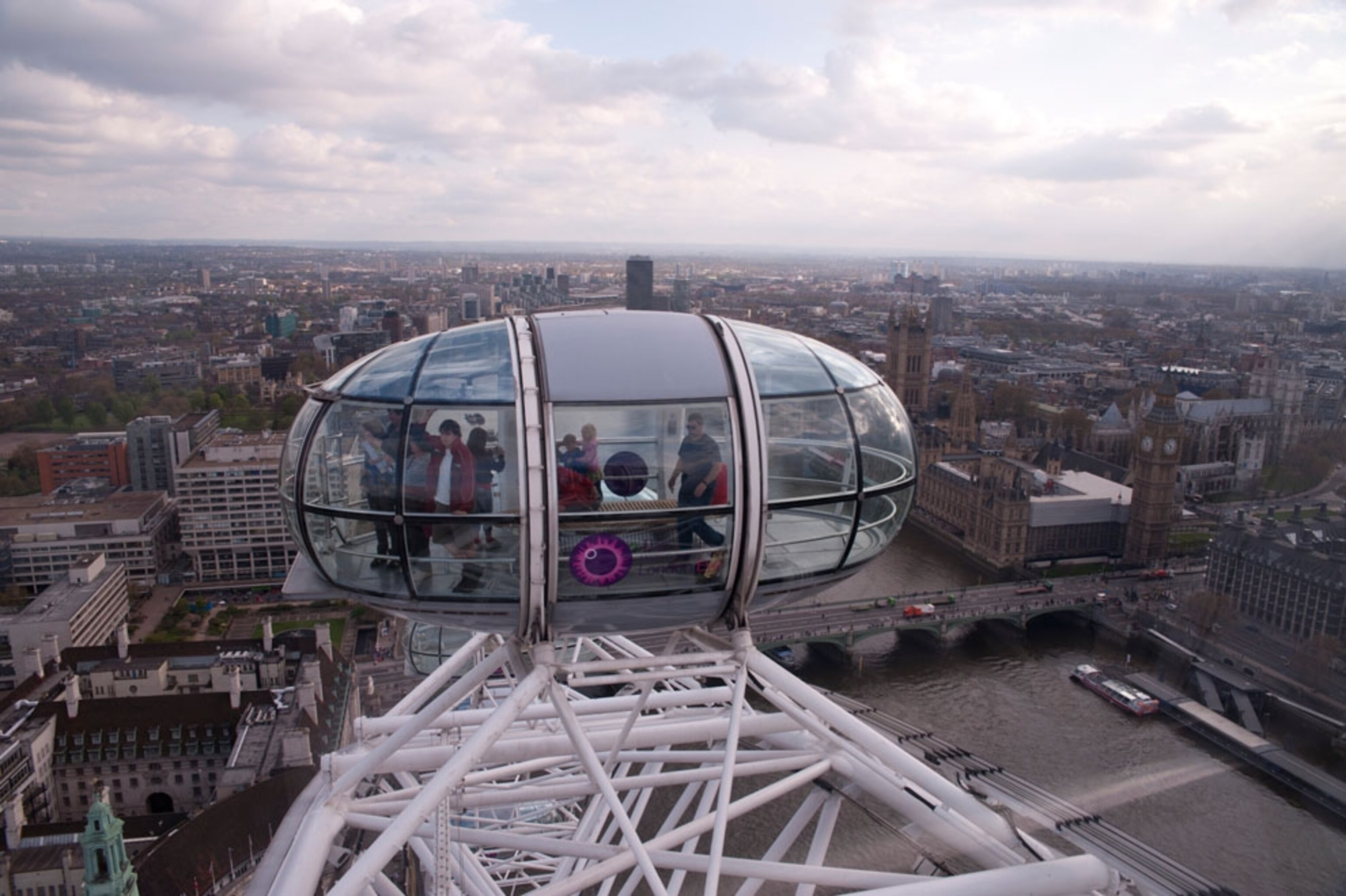 Tourists looking out over London from a capsule on the London Eye