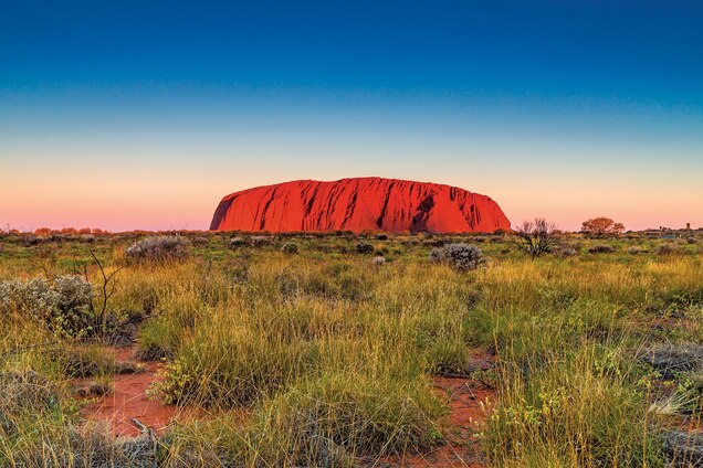 Uluru, or Ayers Rock, glows a rich red at dawn and dusk.