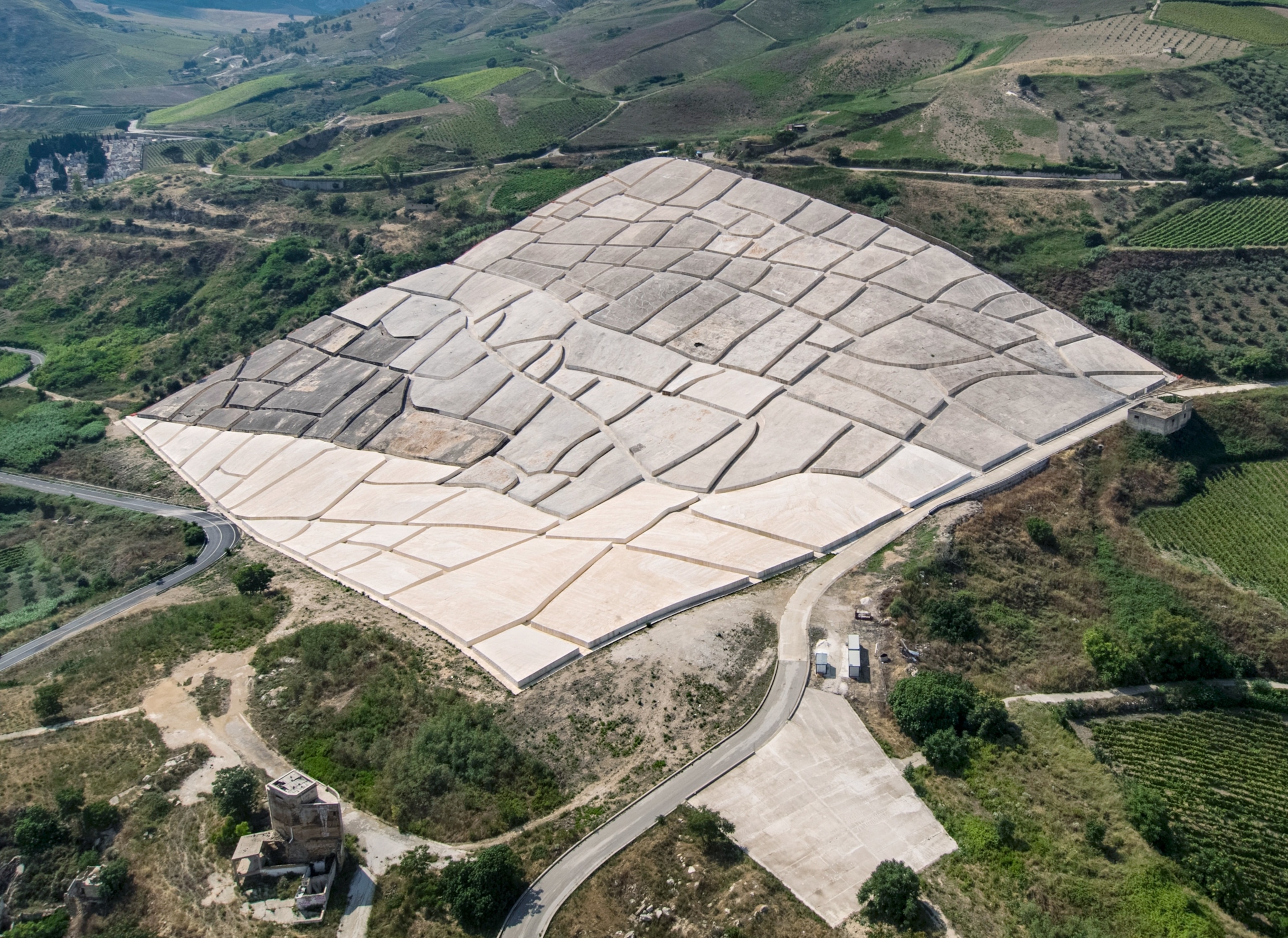 Arial view of the hillside covered with concrete looking like a patchwork blanket.