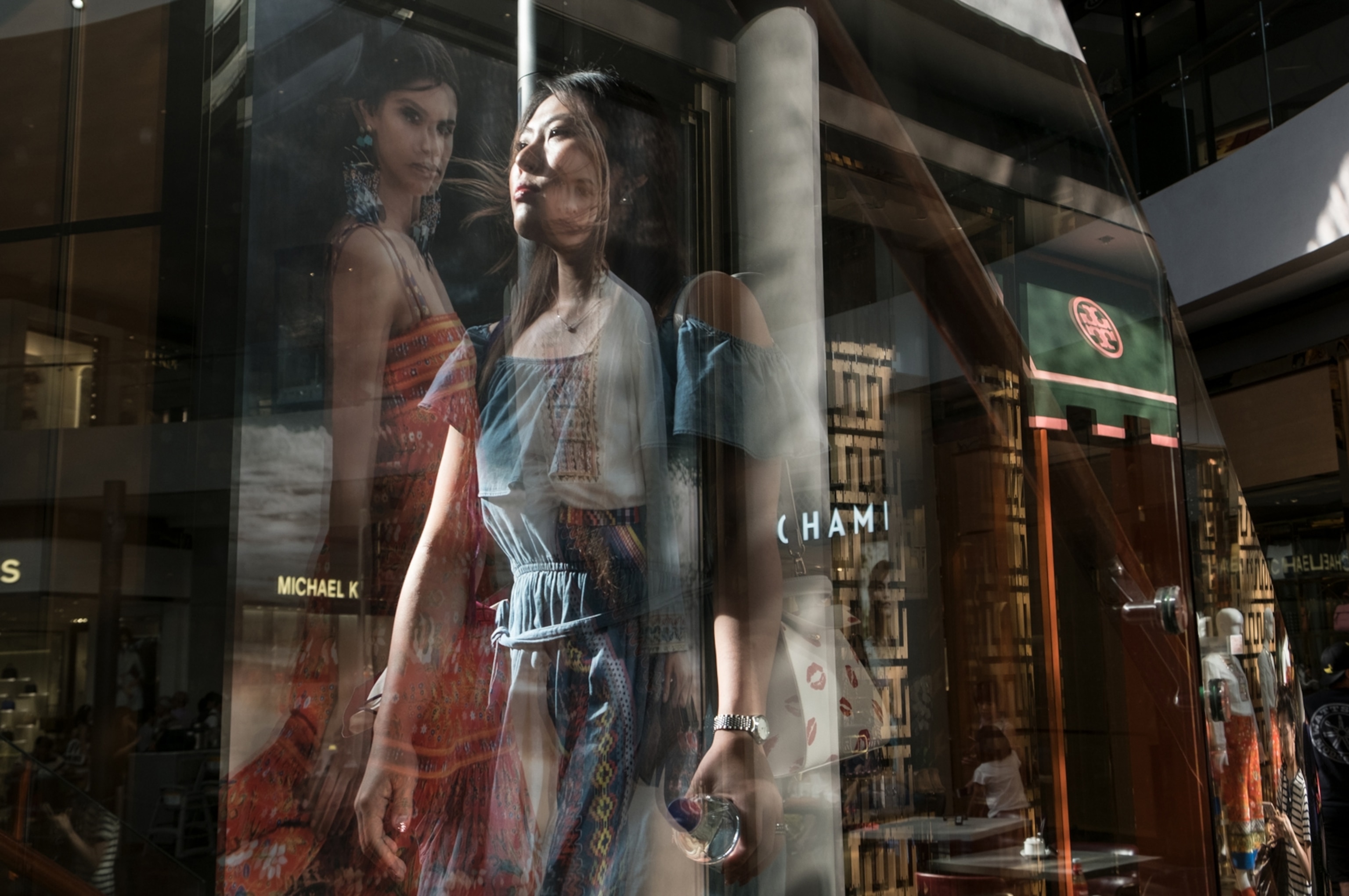 shoppers at Marina Bay Sands with its luxury stores and upscale restaurants, Singapore.