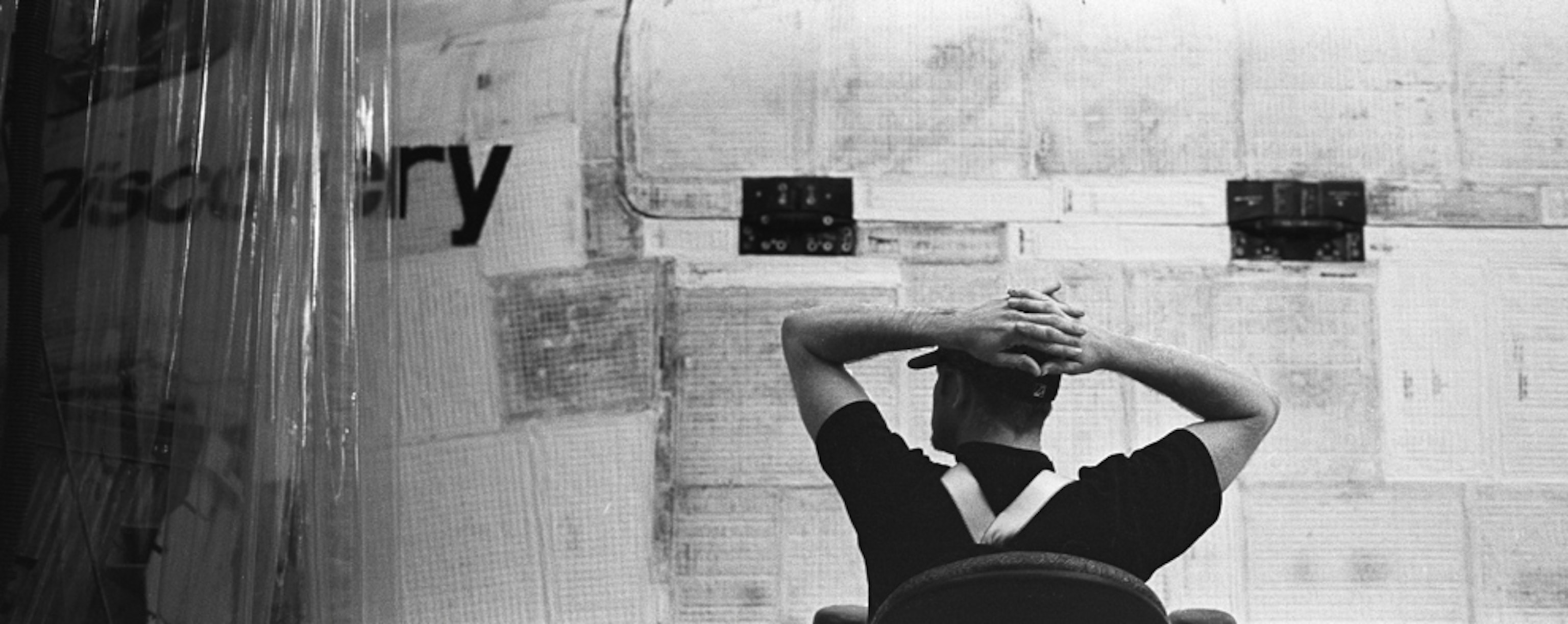 a technician sitting next to Discovery