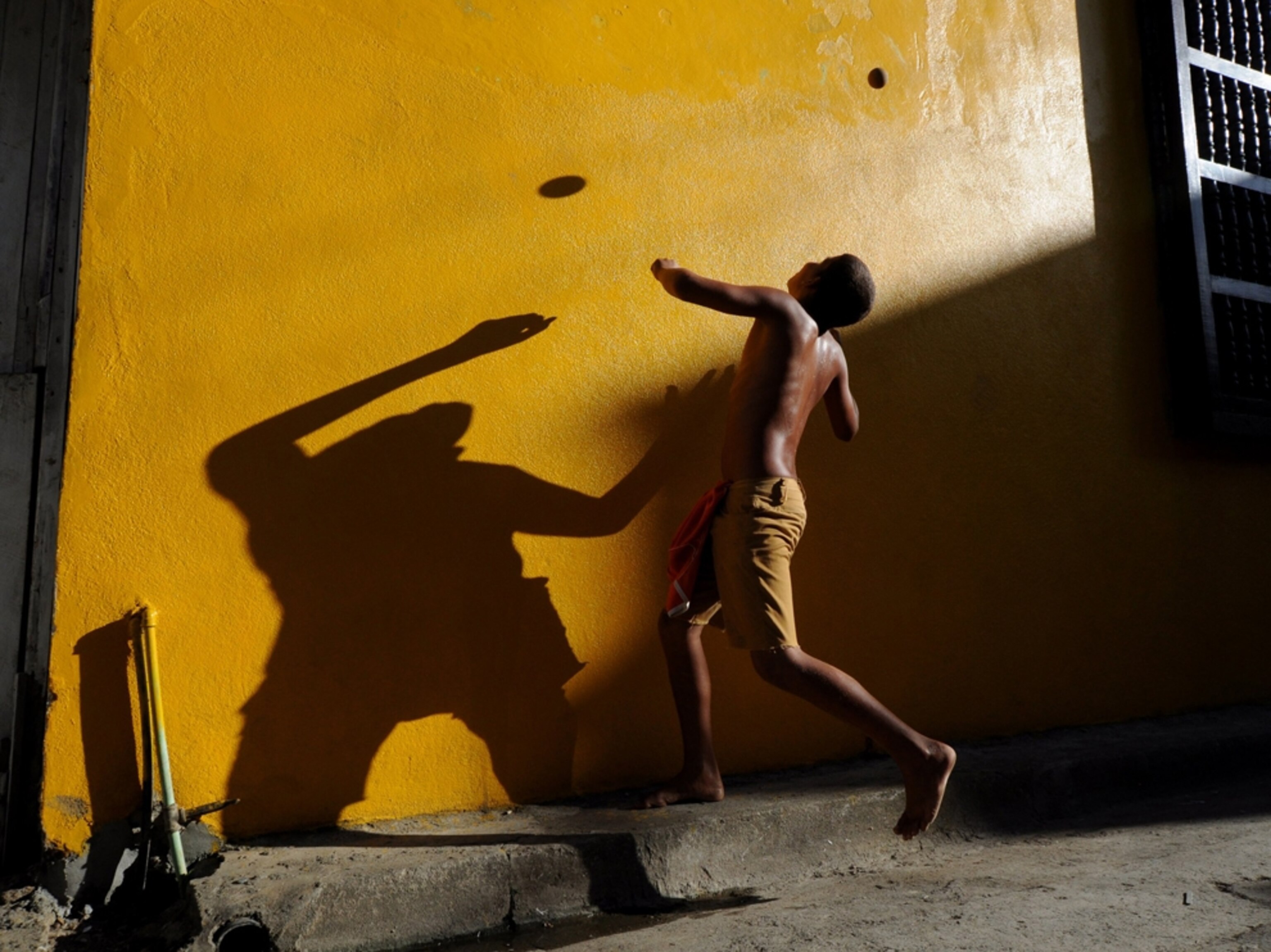 a child playing ball in Cuba