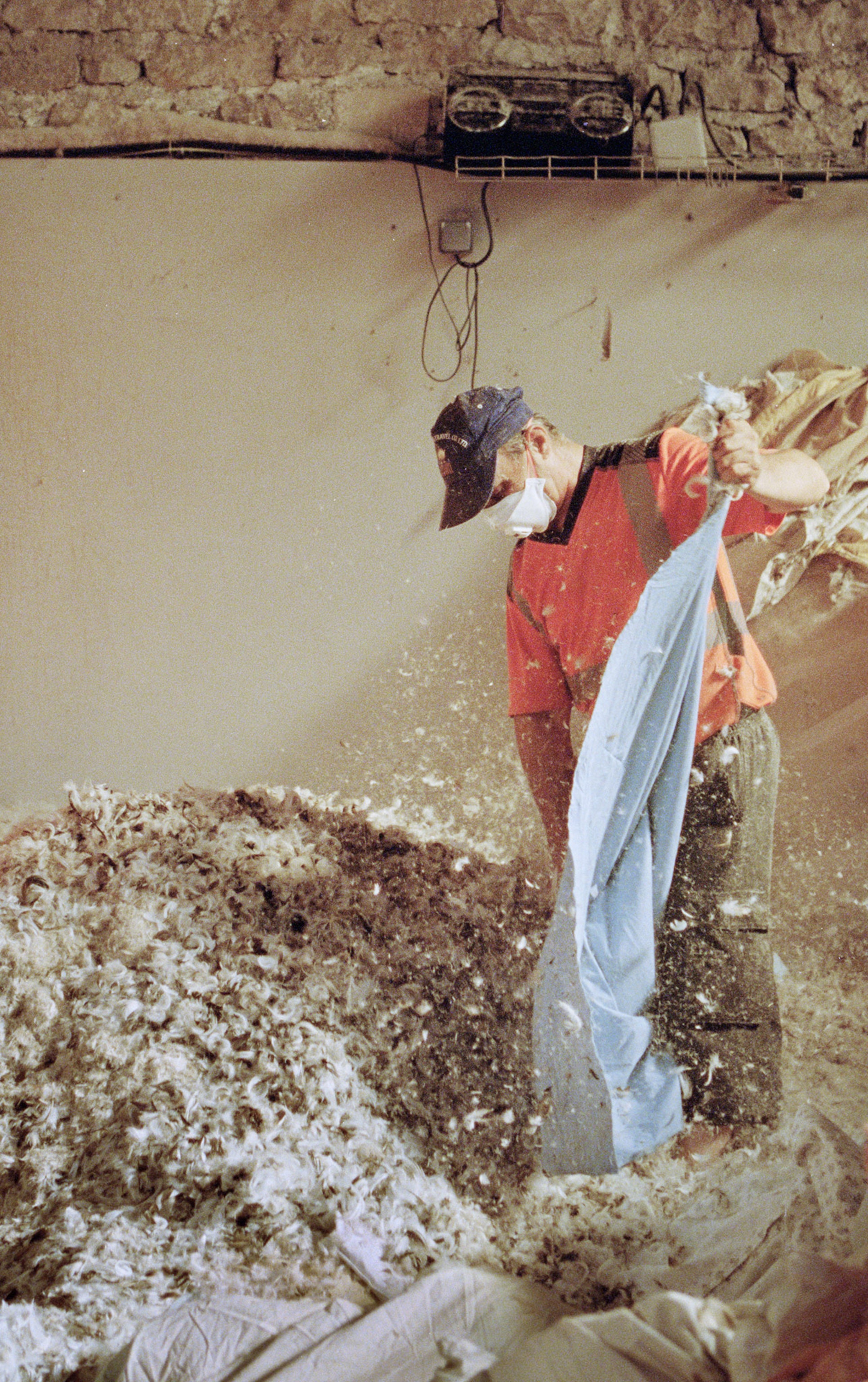 Picture of man in face mask working with down