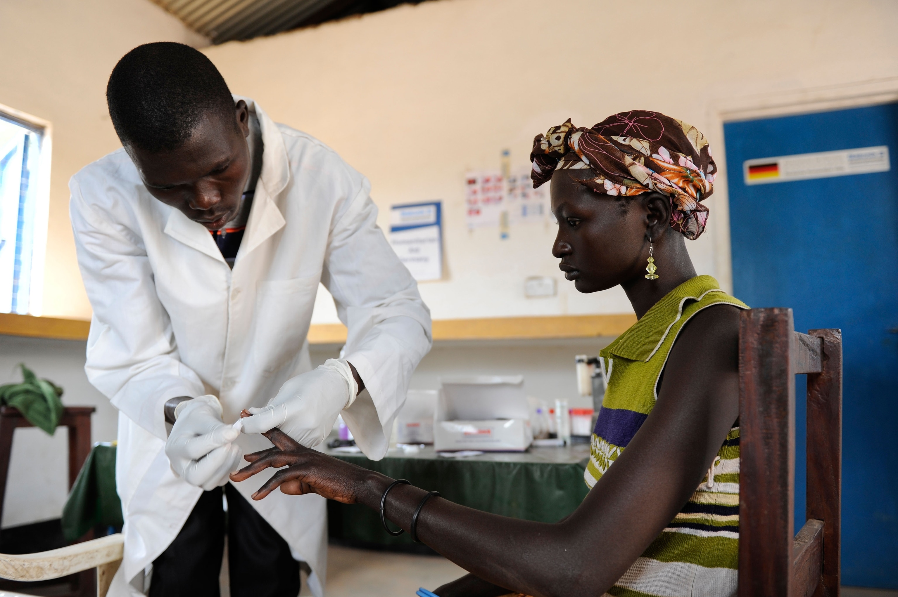 Dinka woman at blood testing for HIV, Aids, and Malaria.