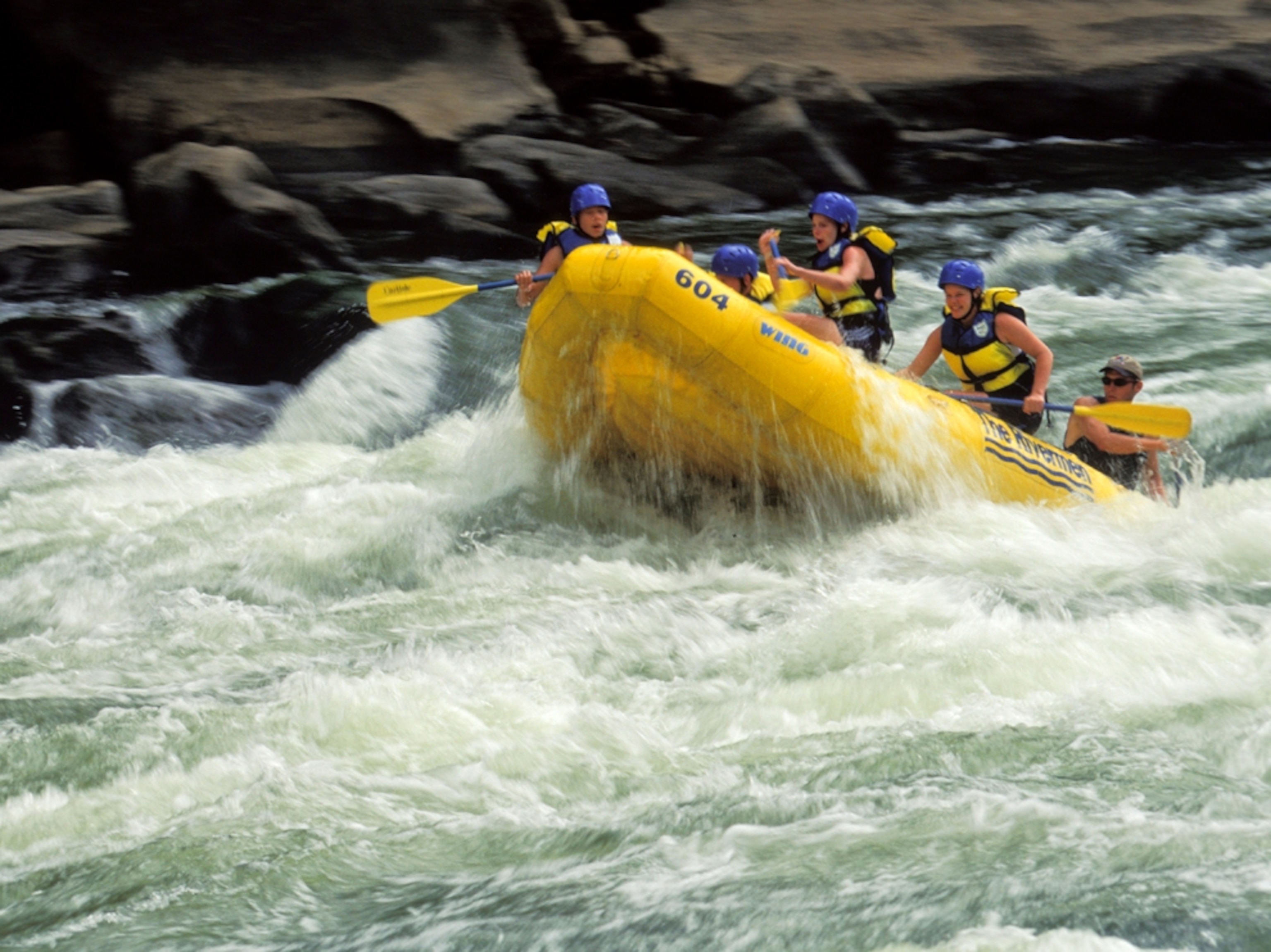 a group whitewater rafting down the New River.