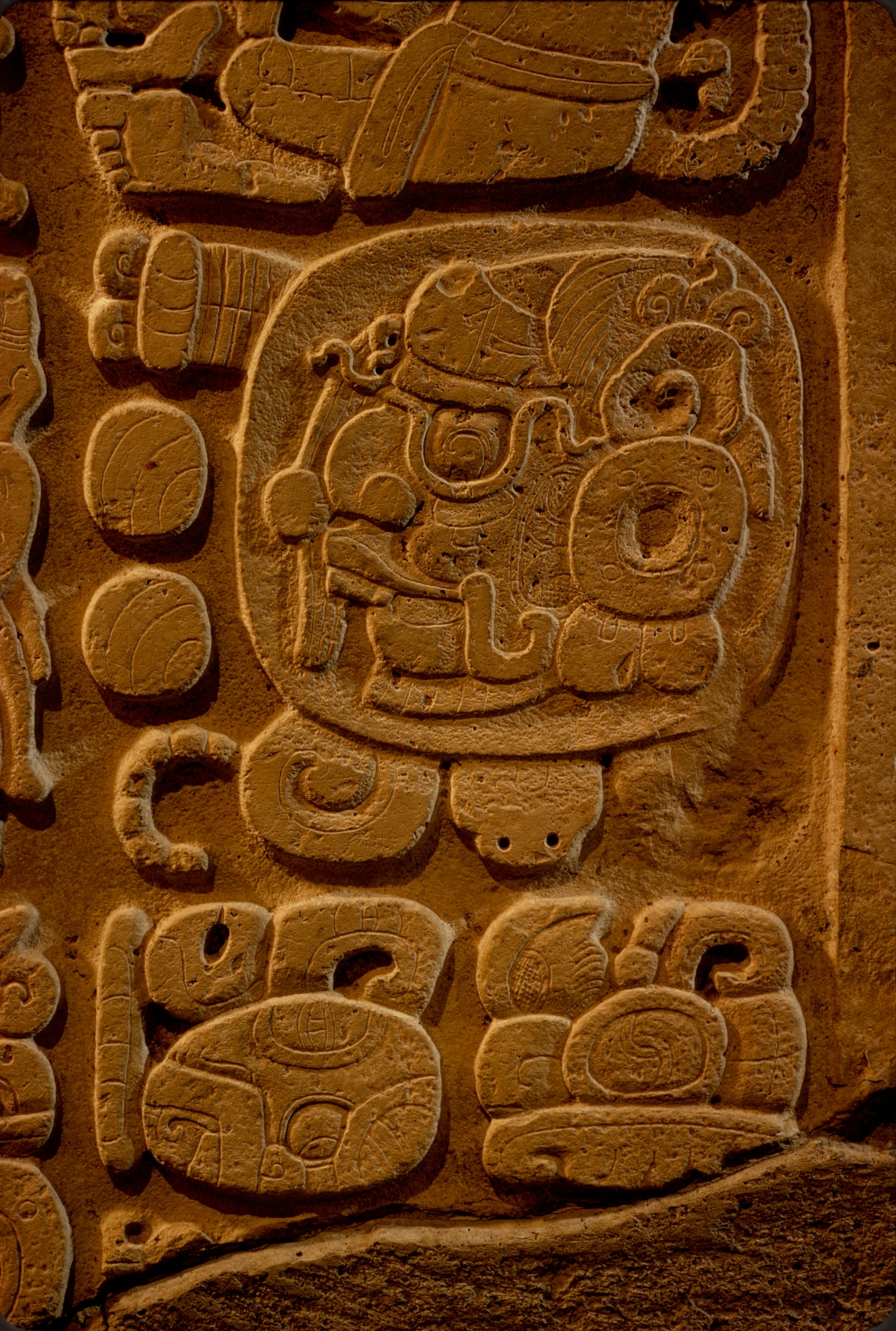 Magnificent obsession of the Maya, time reached its most elaborate expression in glyphs such as these on a limestone lintel from Yaxchilan. Combining head forms and full figures, they portray a single date. Here animals represent blocks of time; the pro files of gods are numbers. The monkey, right, second from top, signals "day"; in his hand a god's head, gazing skyward, means six; the skull below the hand, facing left, is 10. Thus, this glyph stands for 16 days. The sum of the days in all glyphs is added to a starting point in 3114 B.C. to equal February 11, A.D. 526, in our calendar.