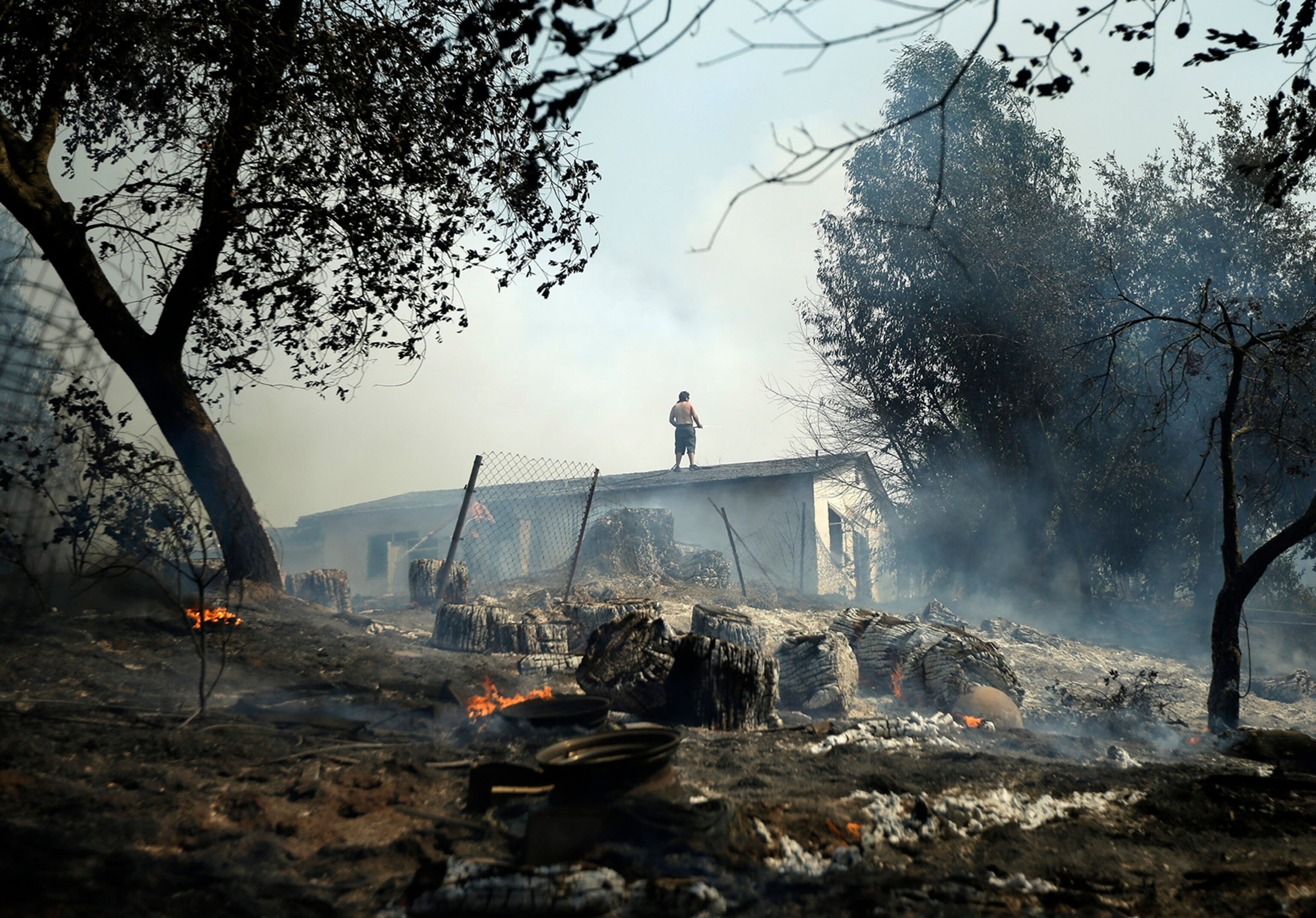 Homes burn in the Smiley Park neighborhood of Running Springs, CA during the Slide Fire in 2007.