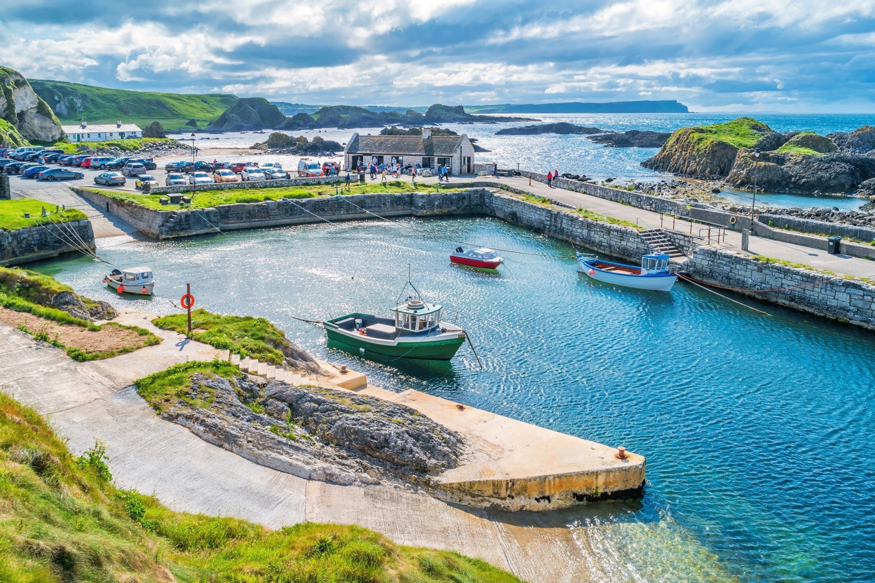 Ballintoy Harbour, the picturesque walled fishing port backed by sea stacks and pocked with caves and rockpools