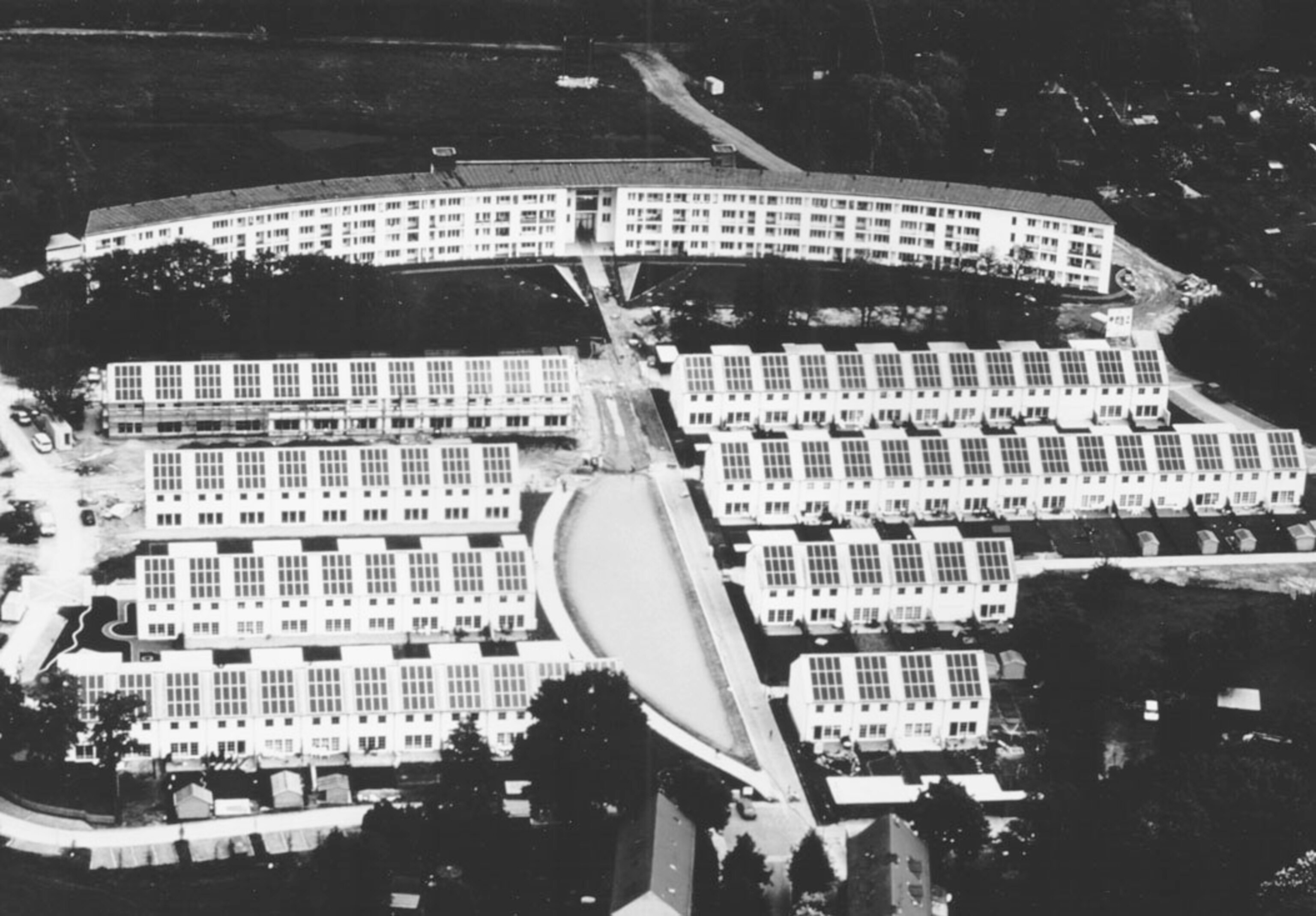 An apartment complex with solar cells mounted on every rooftop.