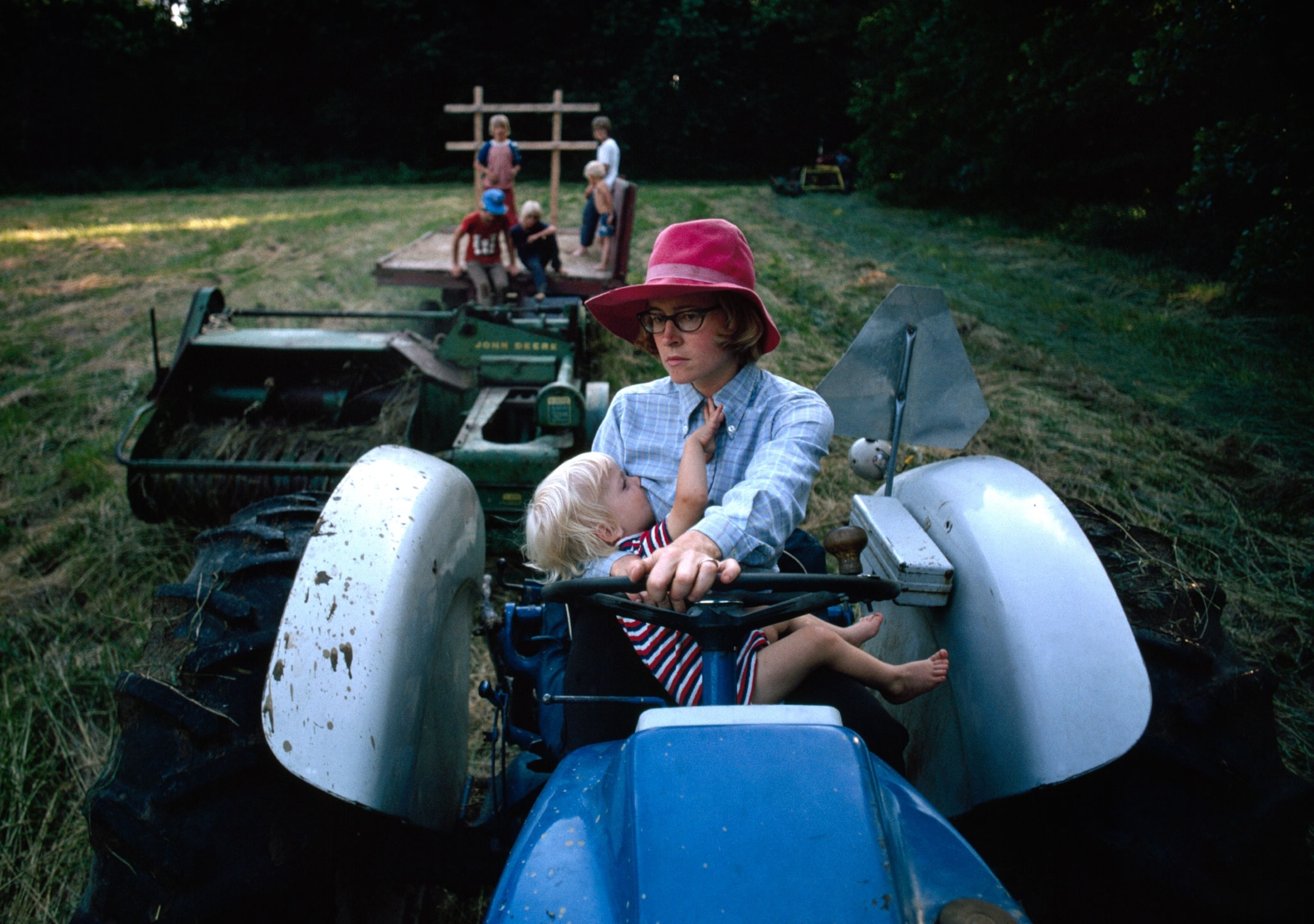 woman on tractor while breastfeeding