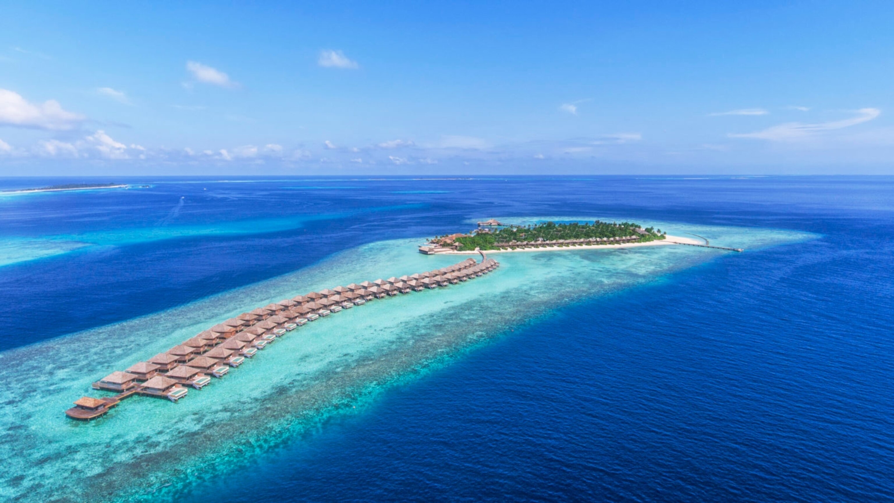 an aerial view of the Hurawalhi Resort in the Maldives