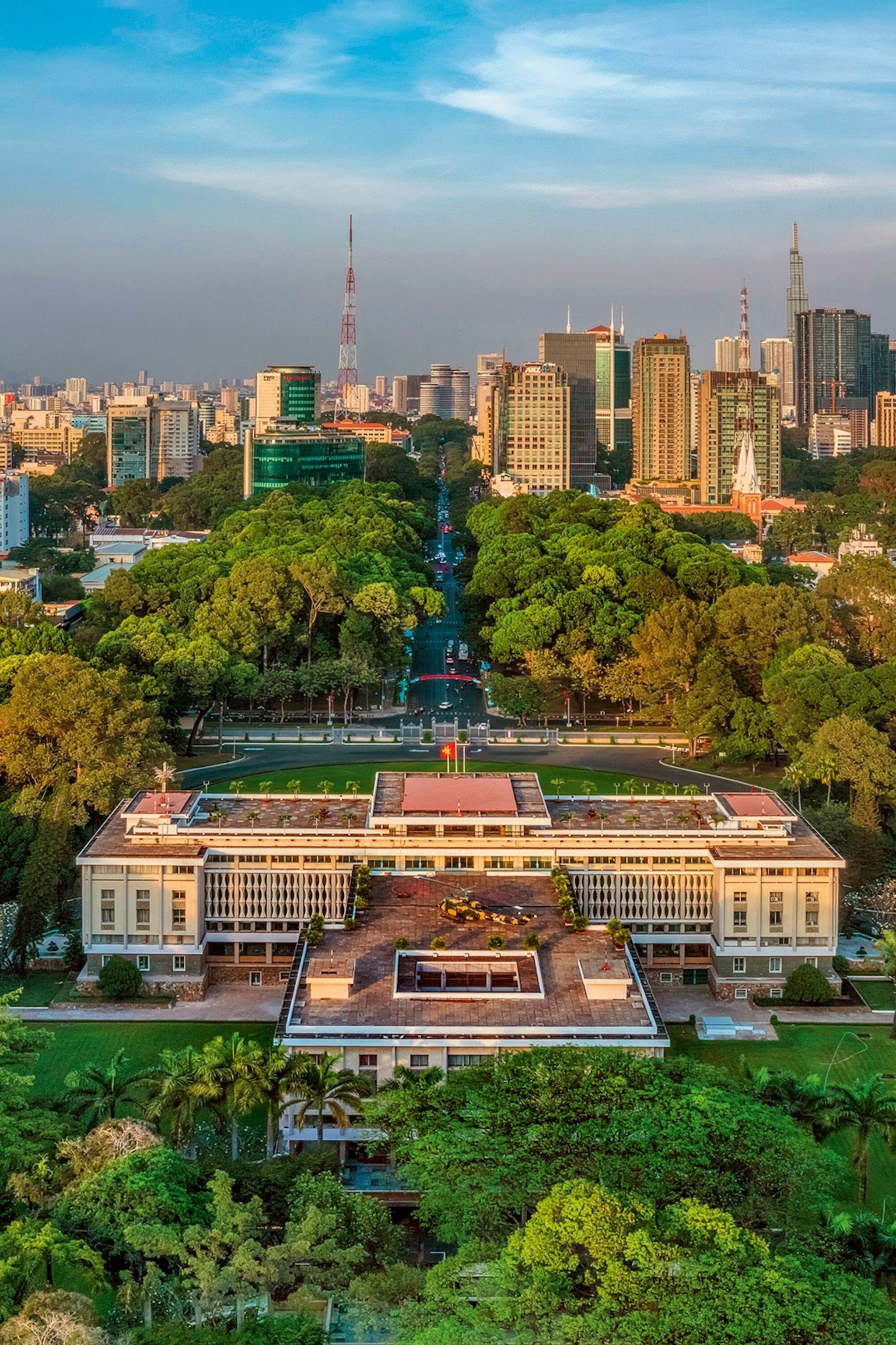 The Reunification Palace in the foreground with Ho Chi Minh City in the background.