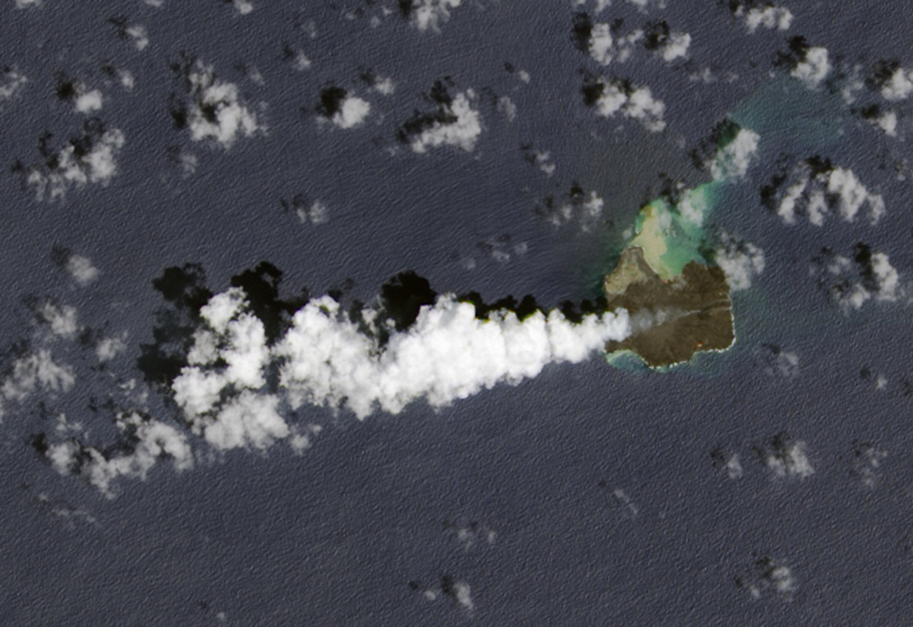 Nine months after a new island broke through the surface of the western Pacific Ocean, the volcanic eruption at Nishino-shima continues. The tiny new volcanic island (“Niijima” in Japanese) merged into Nishino-shima last winter and continued to grow. Steady flows of lava are enlarging the merged island, which is now 1.39 square kilometers
