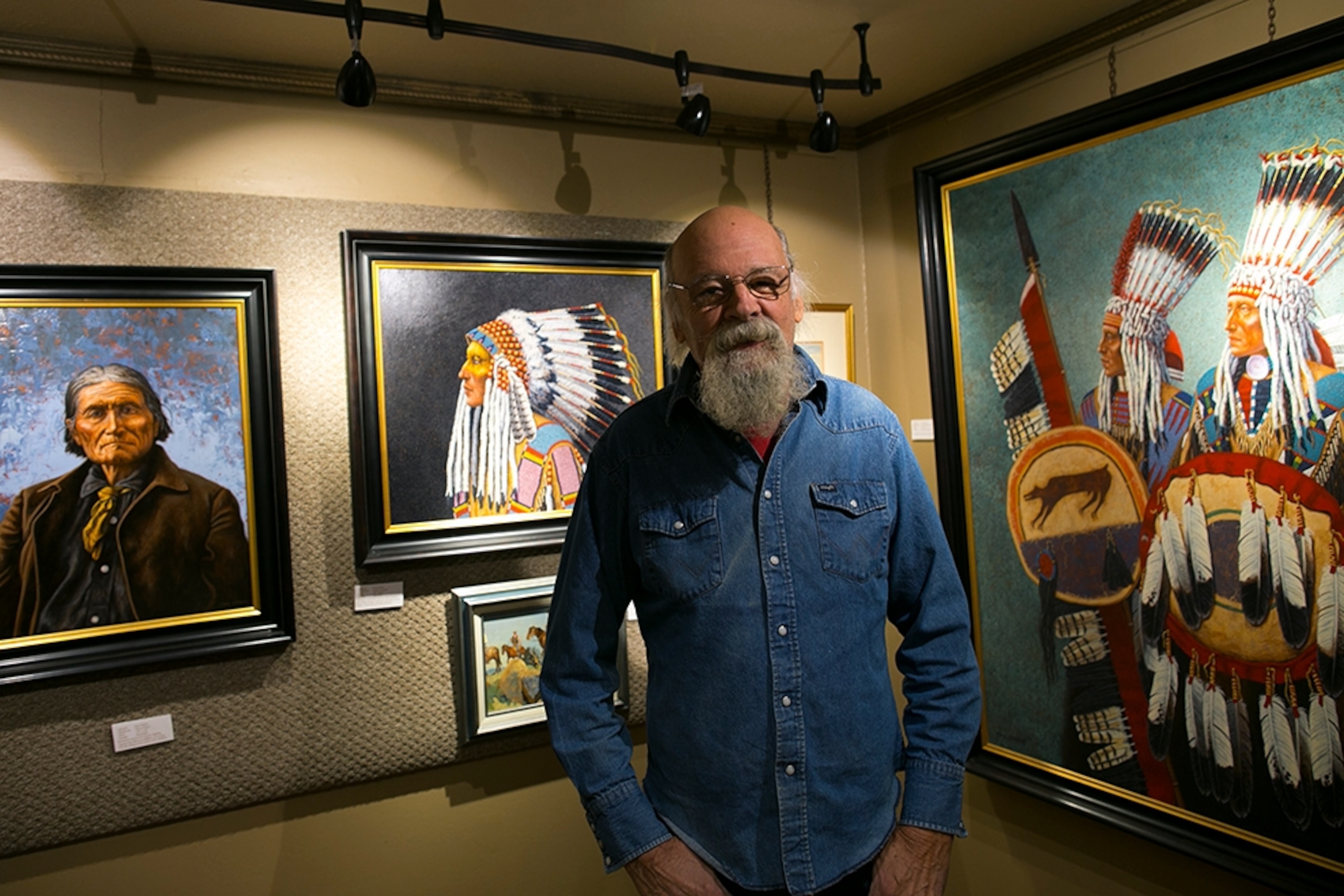 an artist standing in a gallery in Swan Valley, Montana
