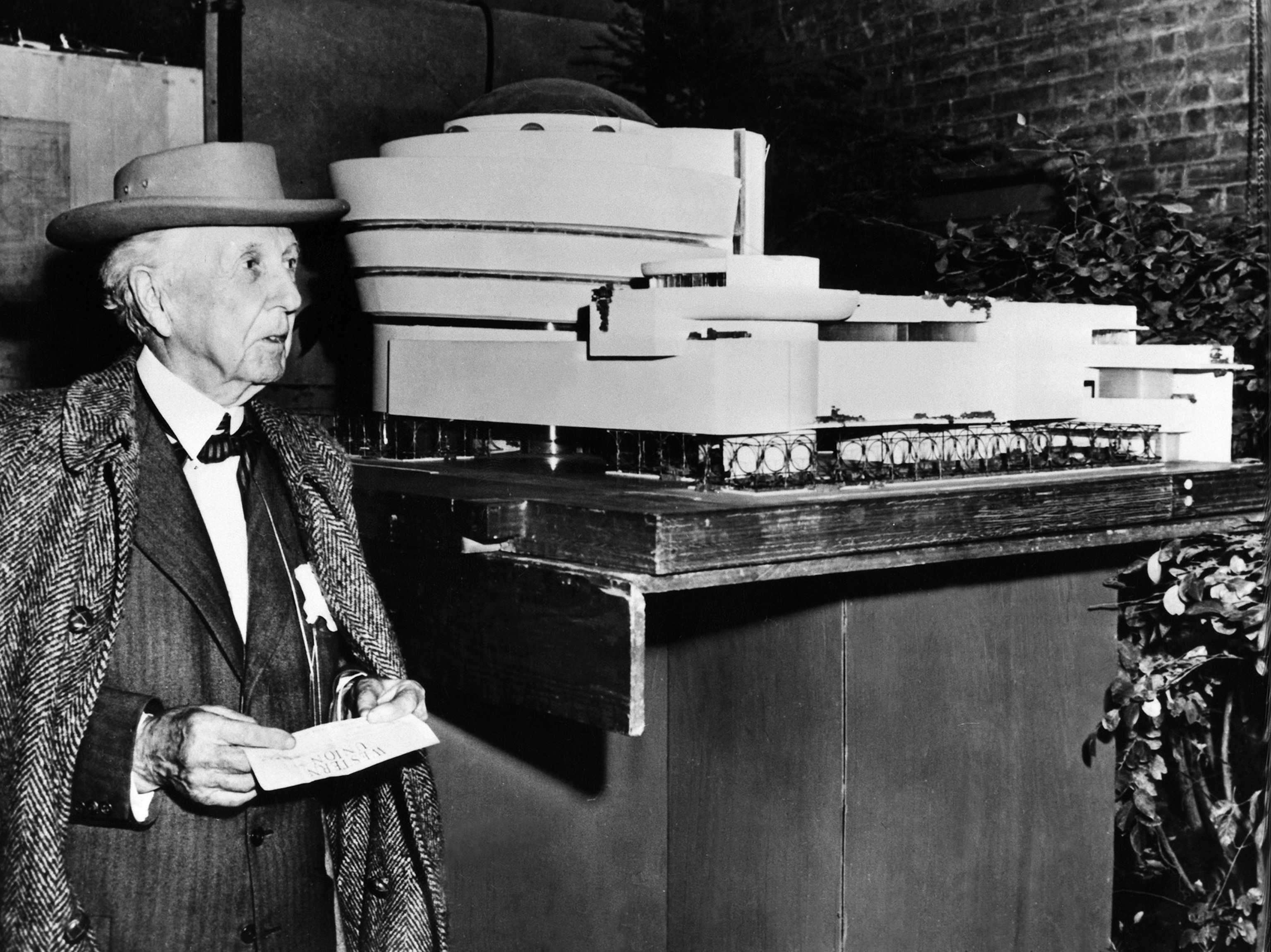 Frank Lloyd Wright and his model of the Guggenheim museum