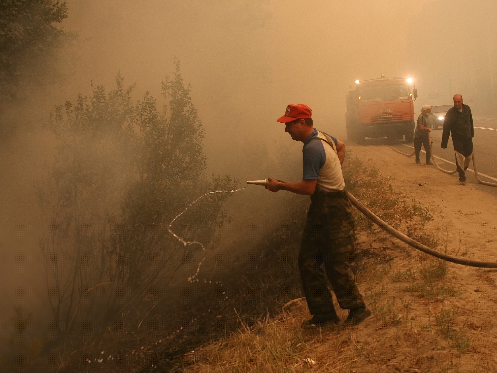 Firefighters battle a wildfire near Laskovo, Russia.