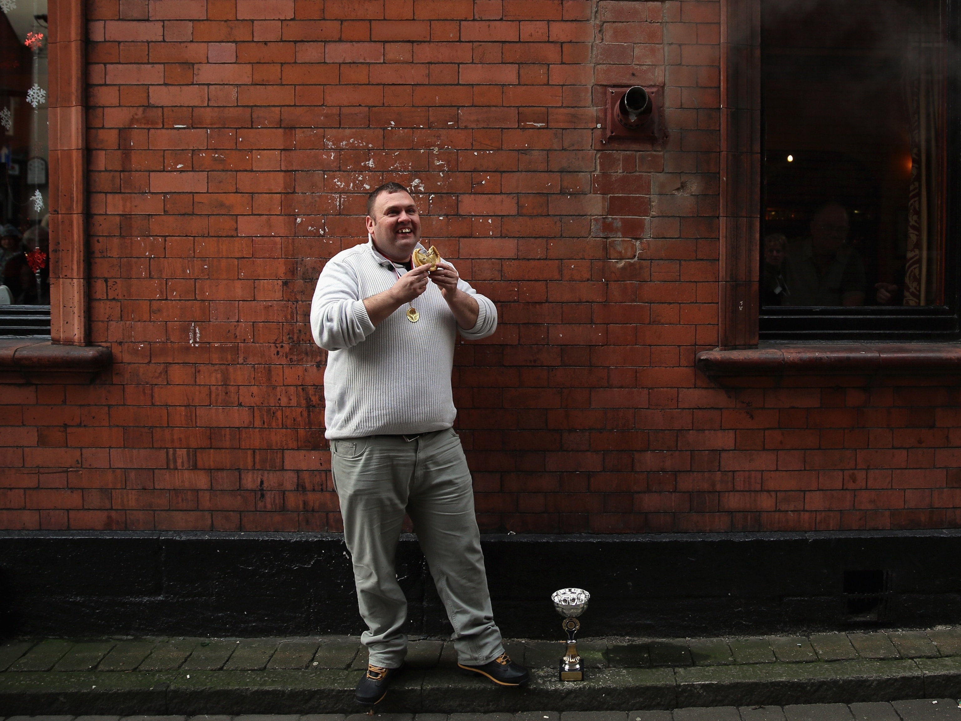 Pie eating champion picture - Martin Clare poses after winning The World Pie Eating Championships