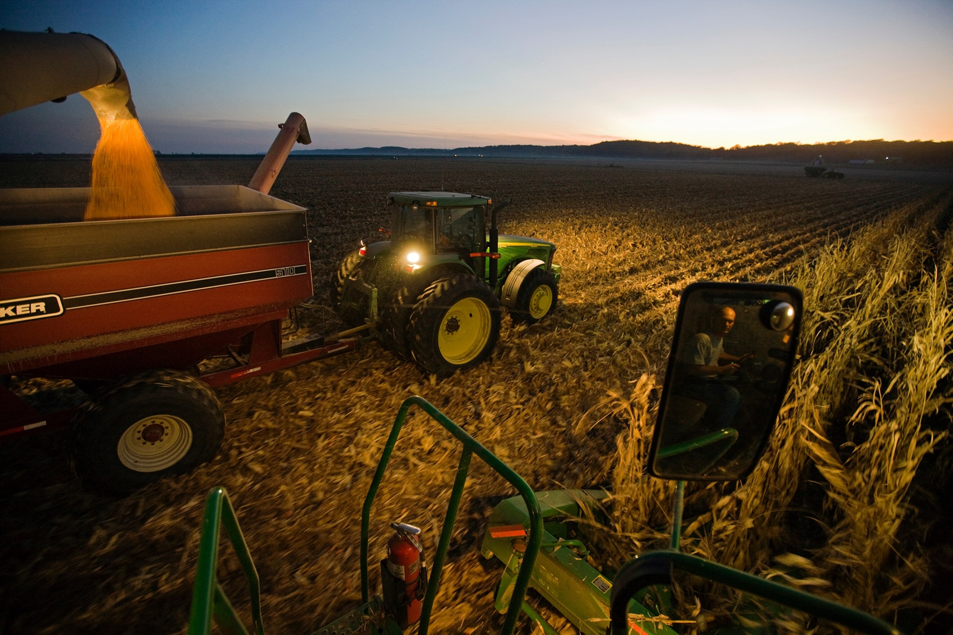 a farmer harvesting corn.