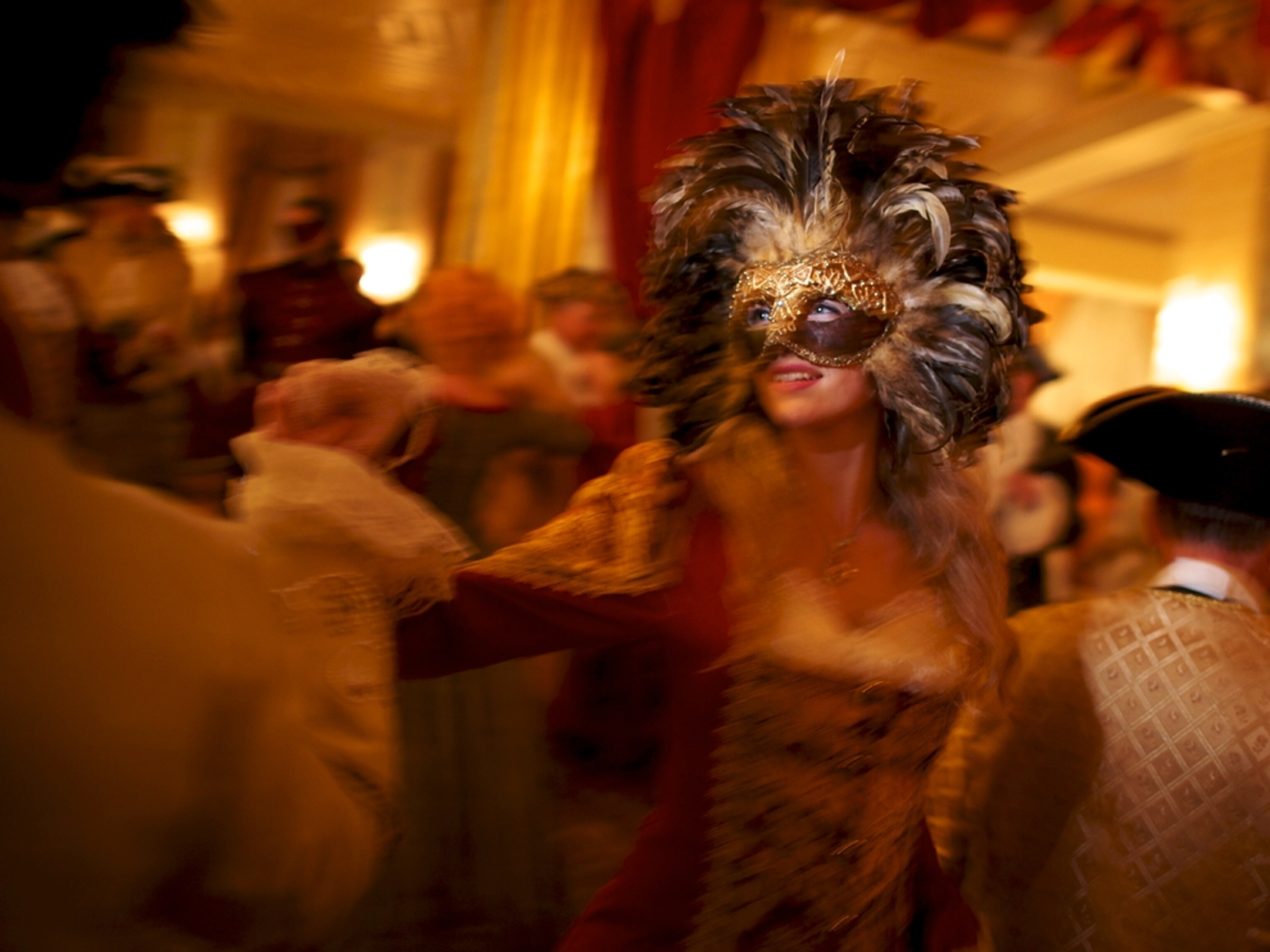 Dancers at masquerade ball