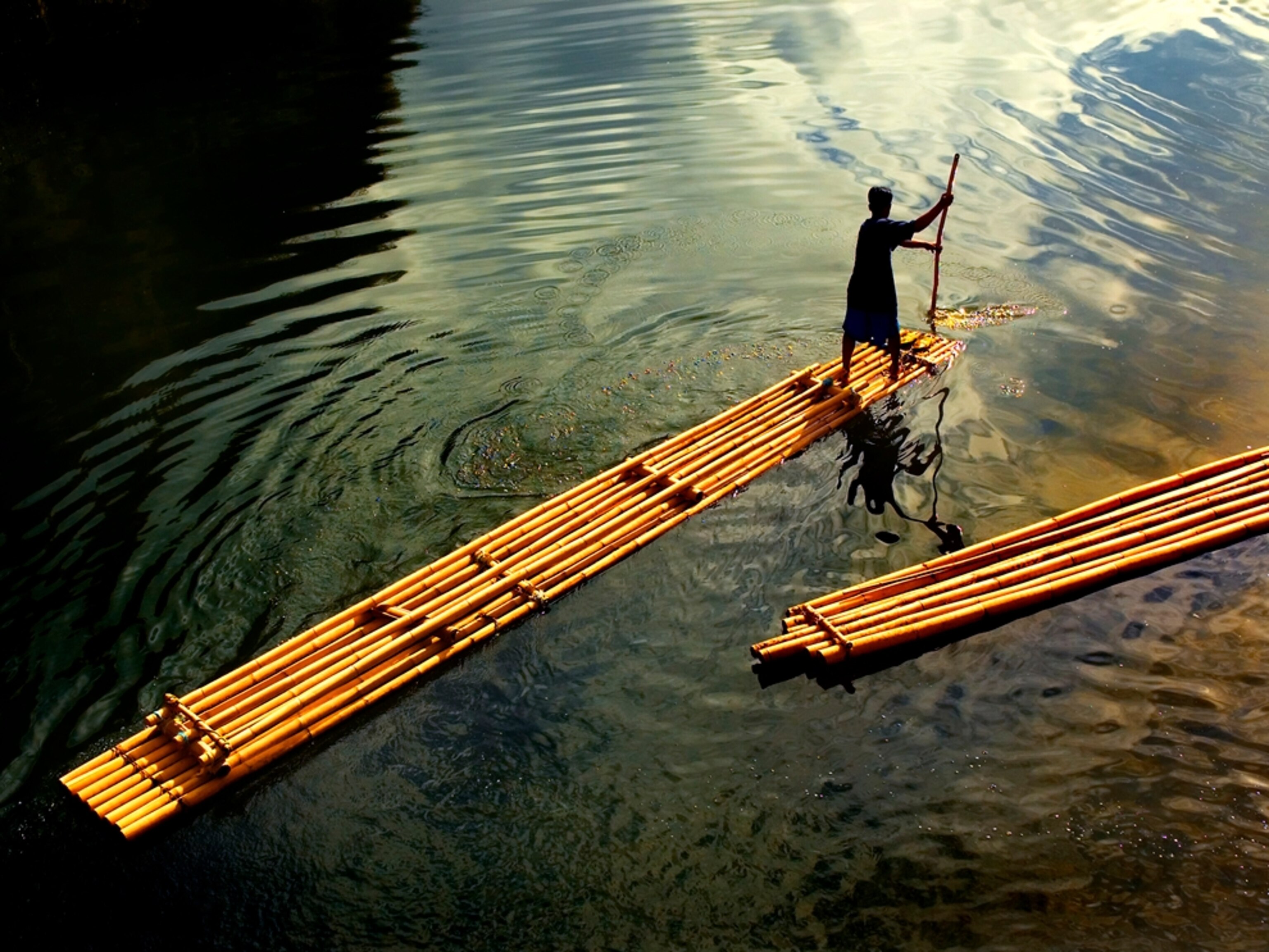 Boatman on a bamboo raft