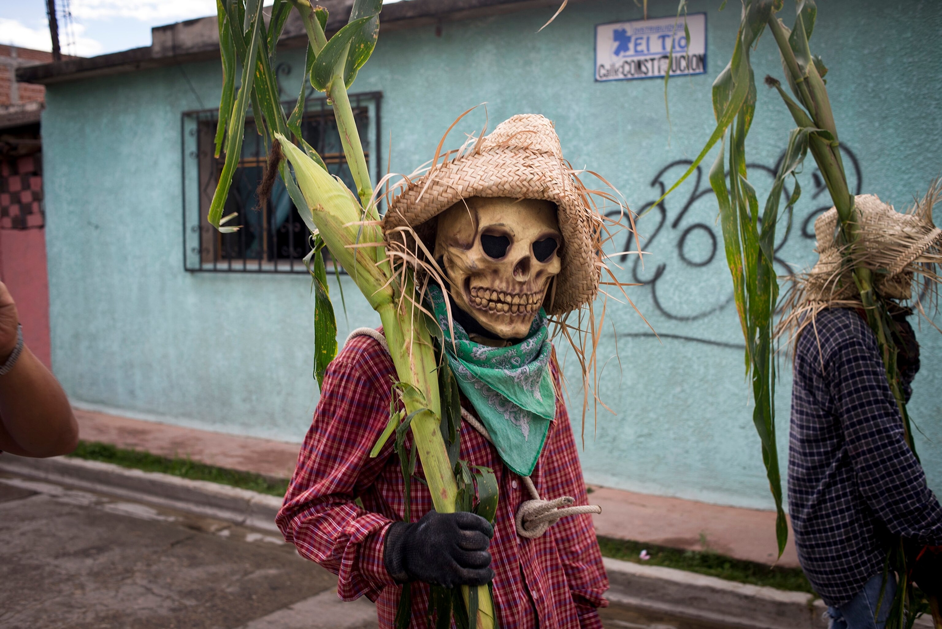 People dressed as death march in a parade on the Day of the Dead in Guadalupe Etla, Oaxaca State, Mexico.