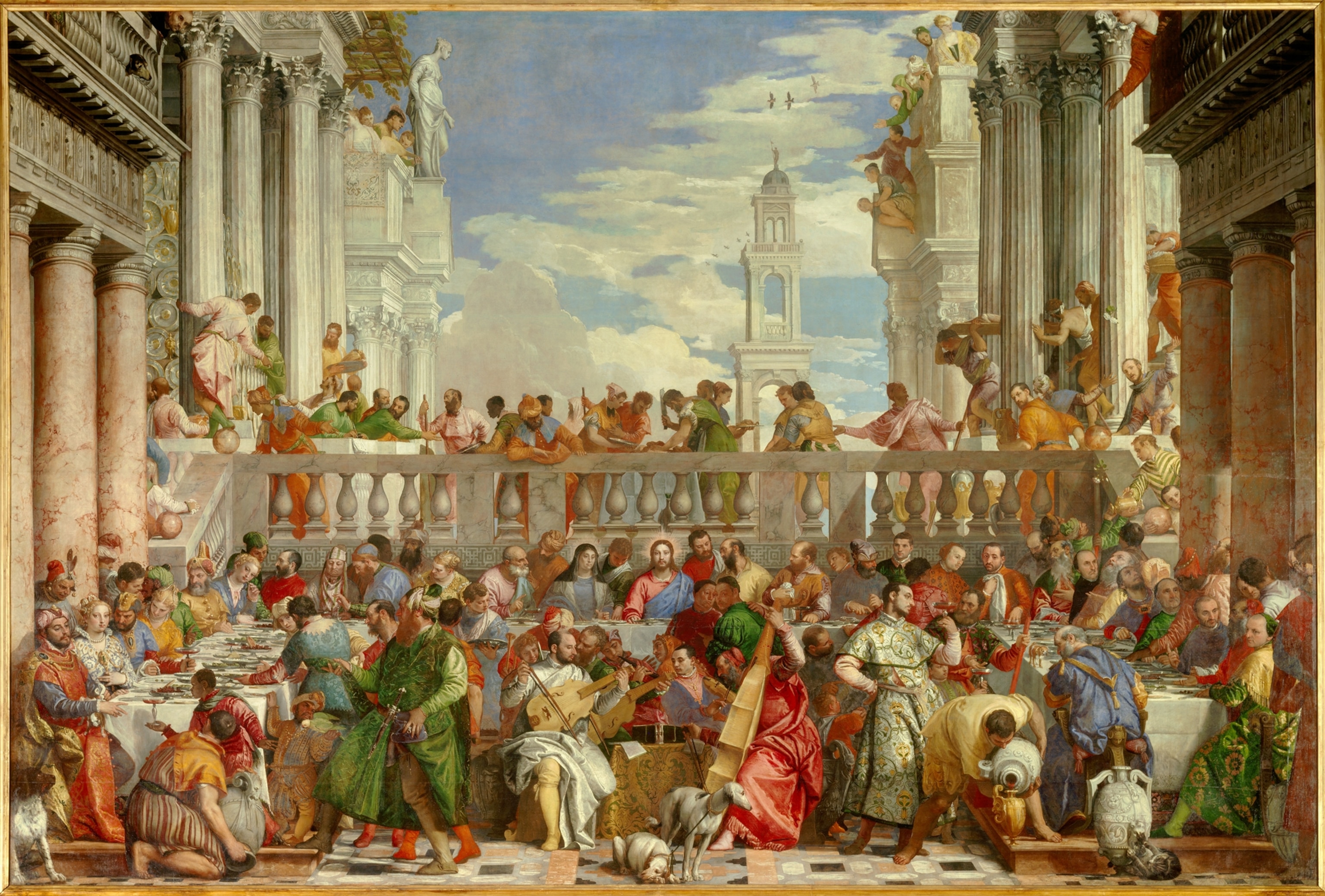 A painting from 16th century AD shows a large ensemble of people gather for a feast at a wedding. Jesus Christ is illustrated in the center transforming water into wine. Guests are dressed in bright greens, blues, pinks and yellows.