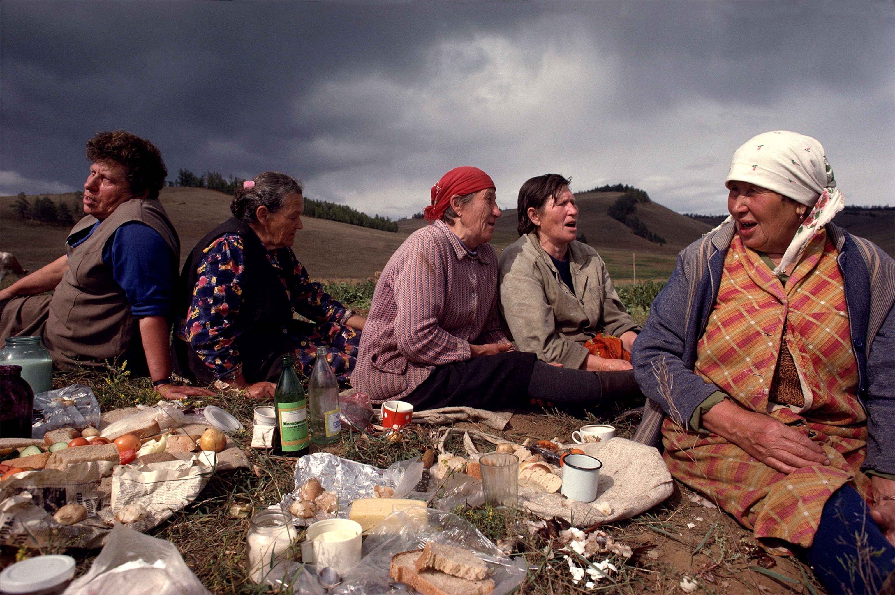 women from the Siberian village of Baikalskoye in Russia singing together at the end of a picnic lunch in 1991.