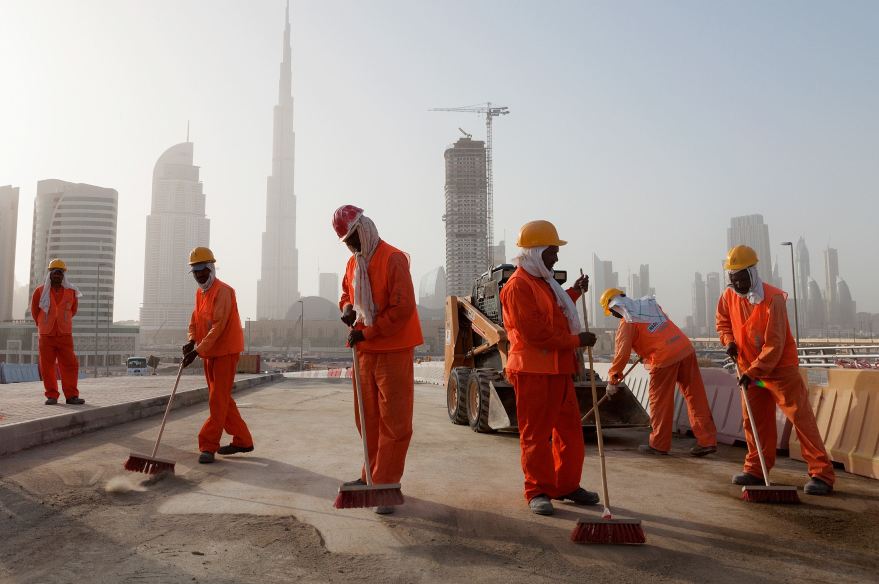 Pakistani and Indian guest workers in Dubai with the Burj Khalifa in the background