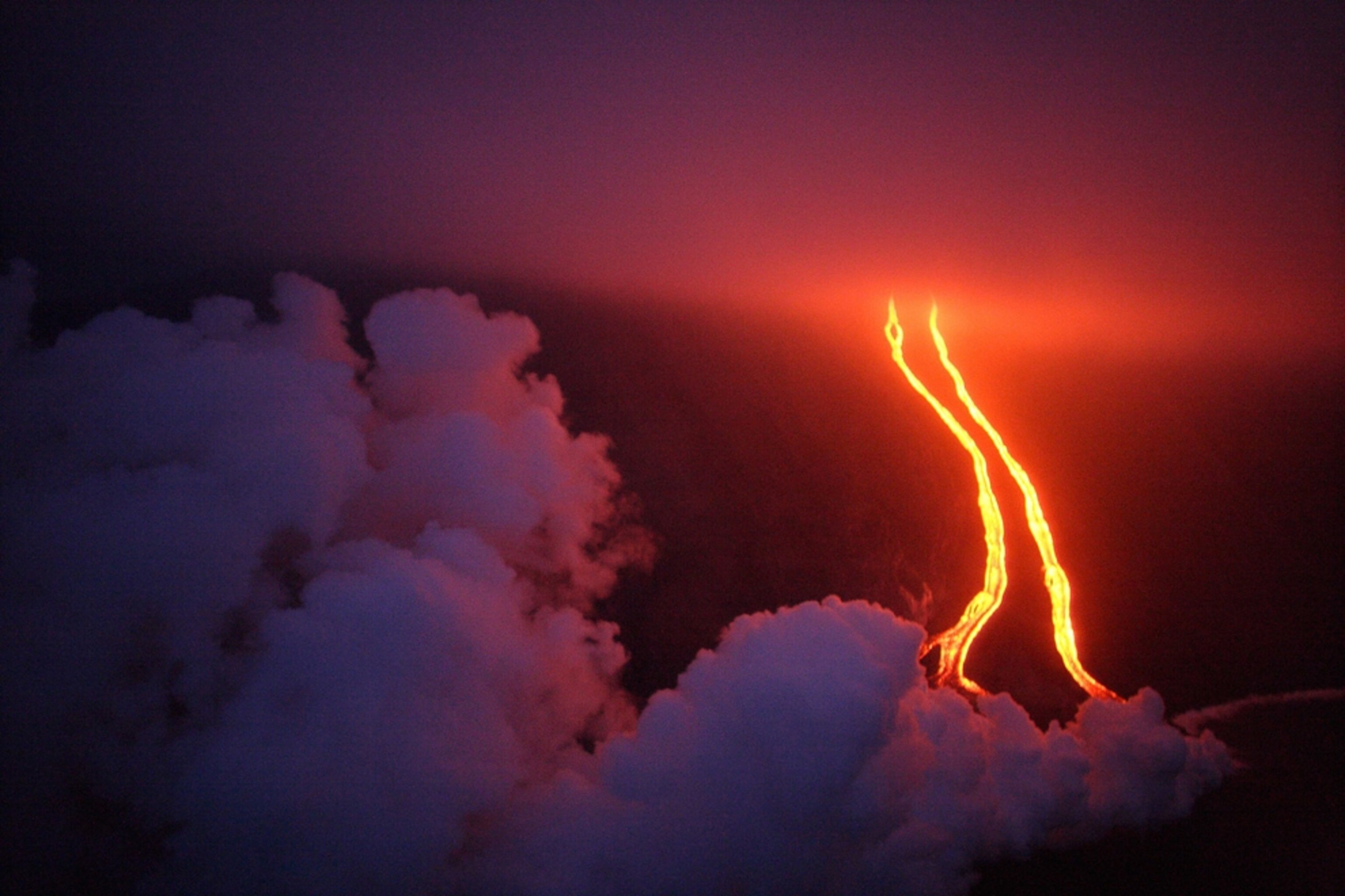 Volcano picture: Lava streams glow as Stromboli Volcano erupts in Sicily, for a gallery on volcano tourism
