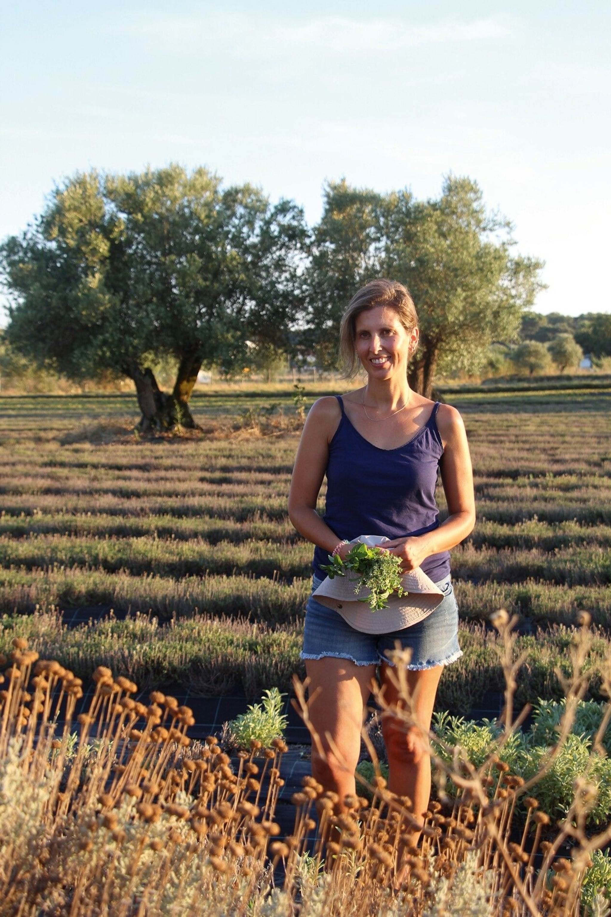 Rute Porto, the owner of Be Aromatic, a three-hectare holding near Évora, in her herb fields.
