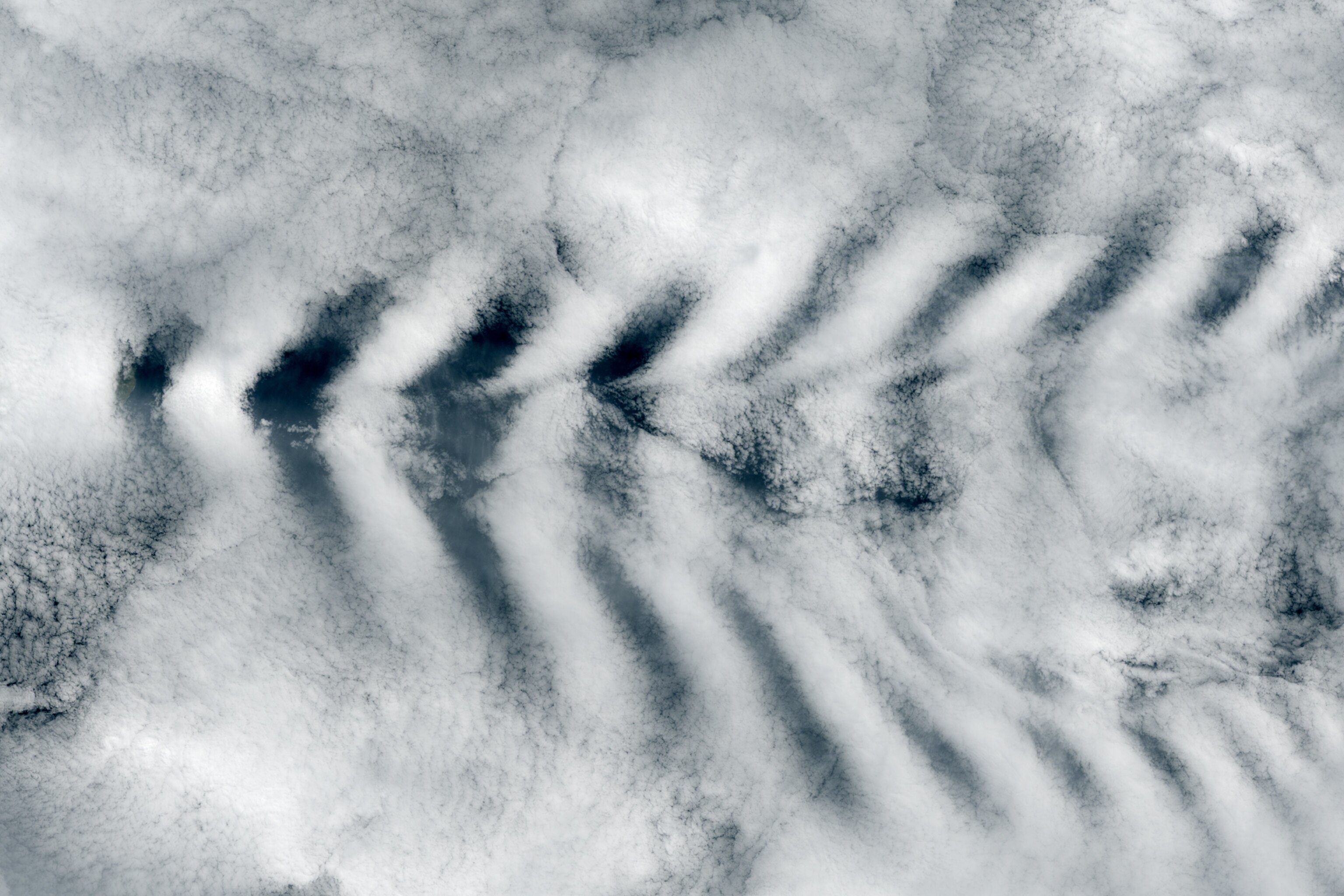 Aerial photo of cloud wakes behind Amsterdam Island.