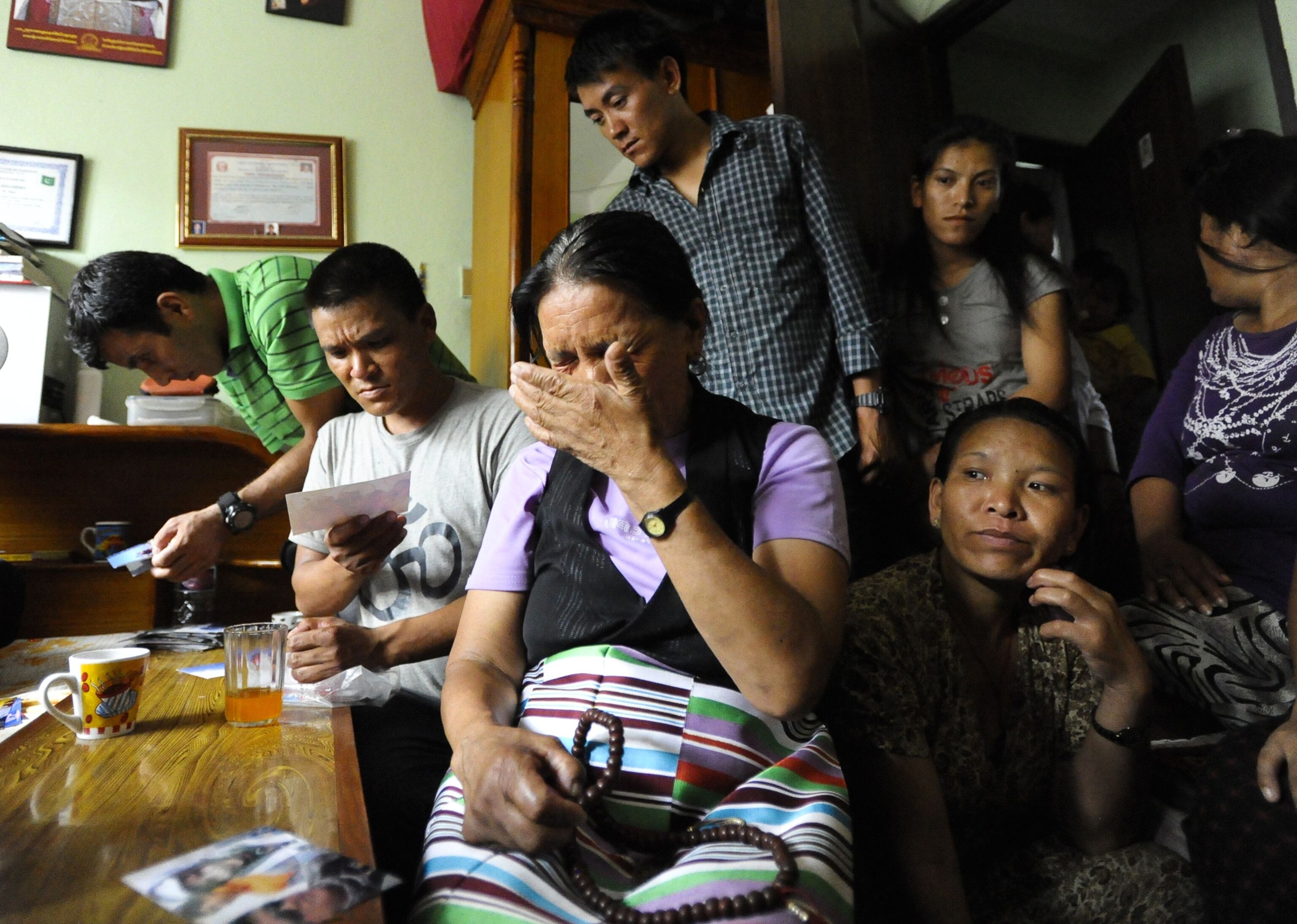 Family members grieve after a climber was killed.